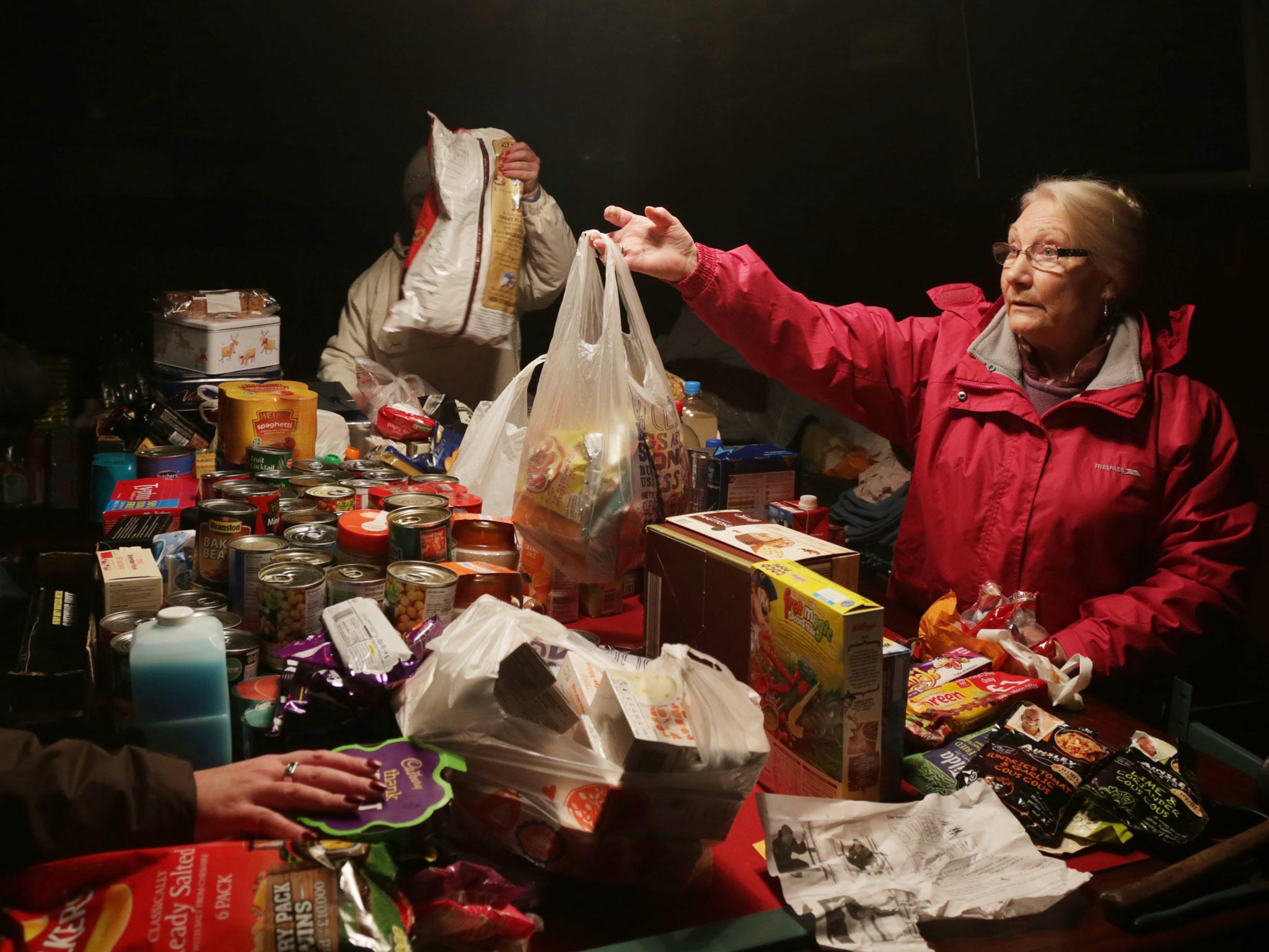 Volunteers sort out food donations in the King Alfred Inn at Burrowbridge on the Somerset Levels