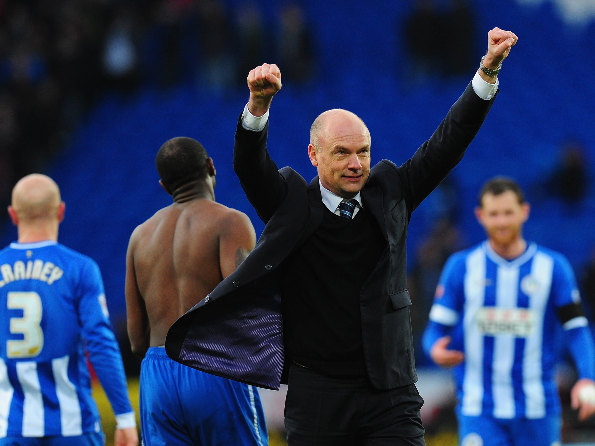 Uwe Rosler celebrates Wigan's victory over Cardiff