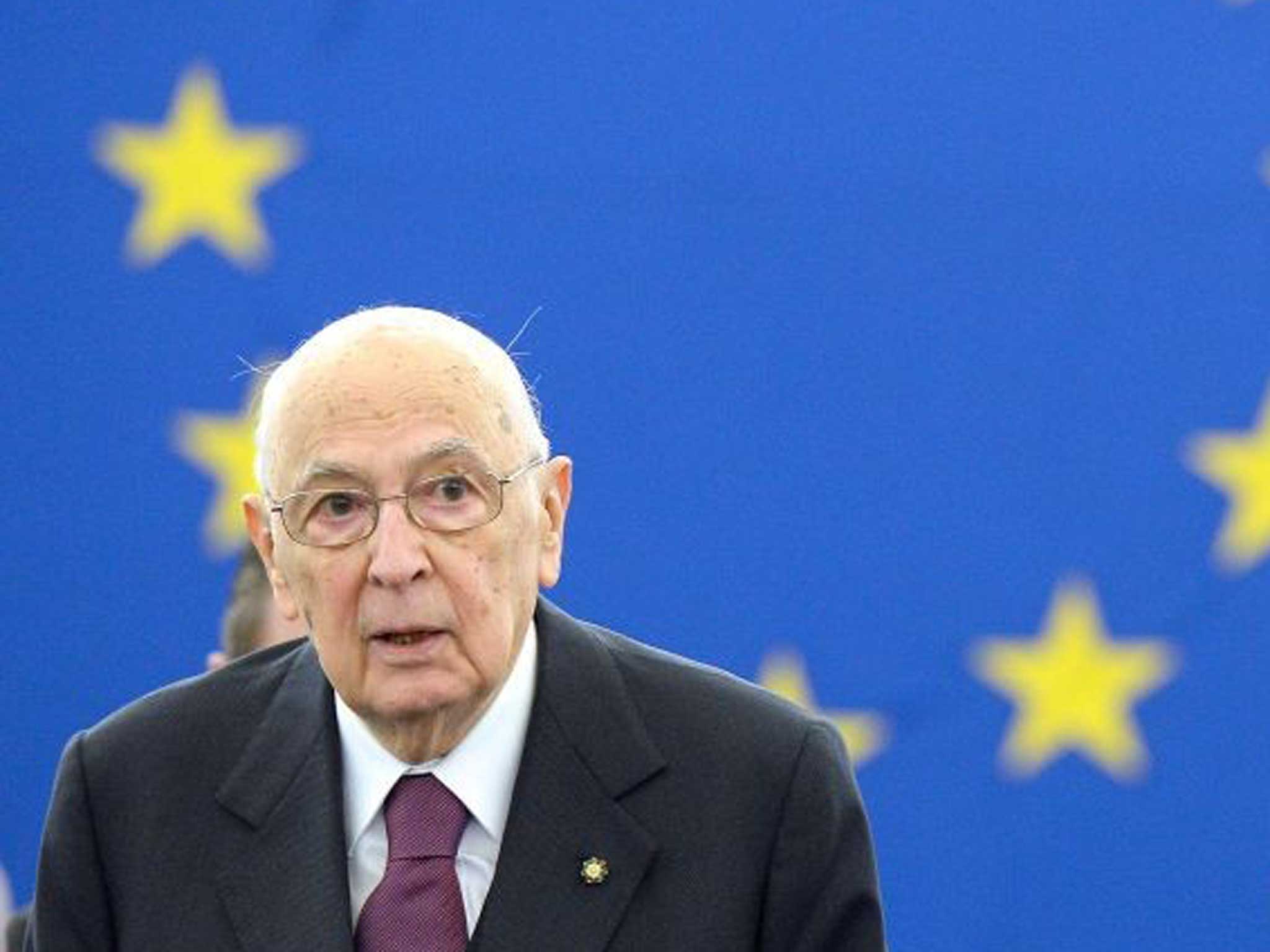 Italy's president Giorgio Napolitano looks on