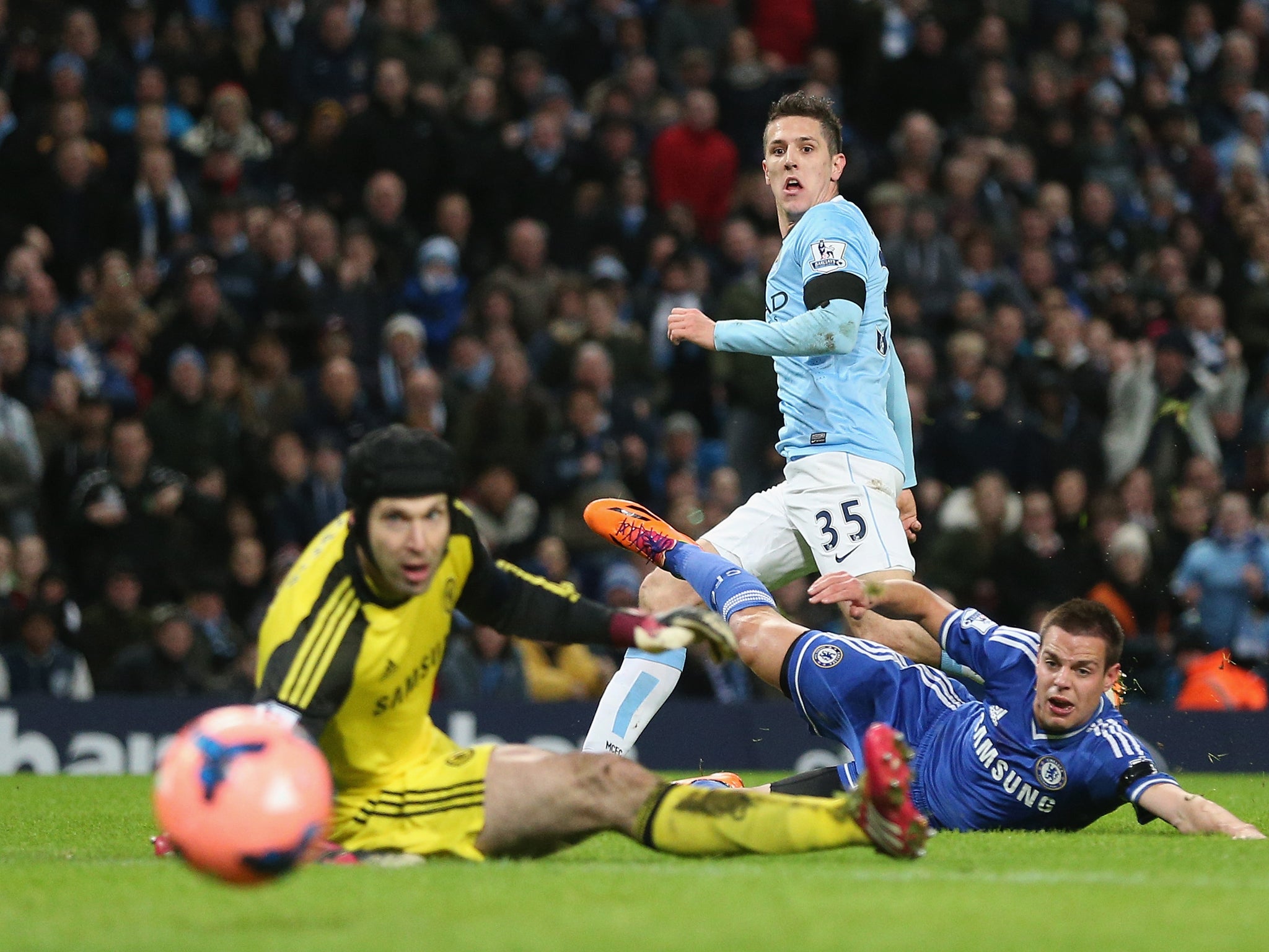 Striker Stevan Jovetic watches his shot head goal-bound as he opens the scoring