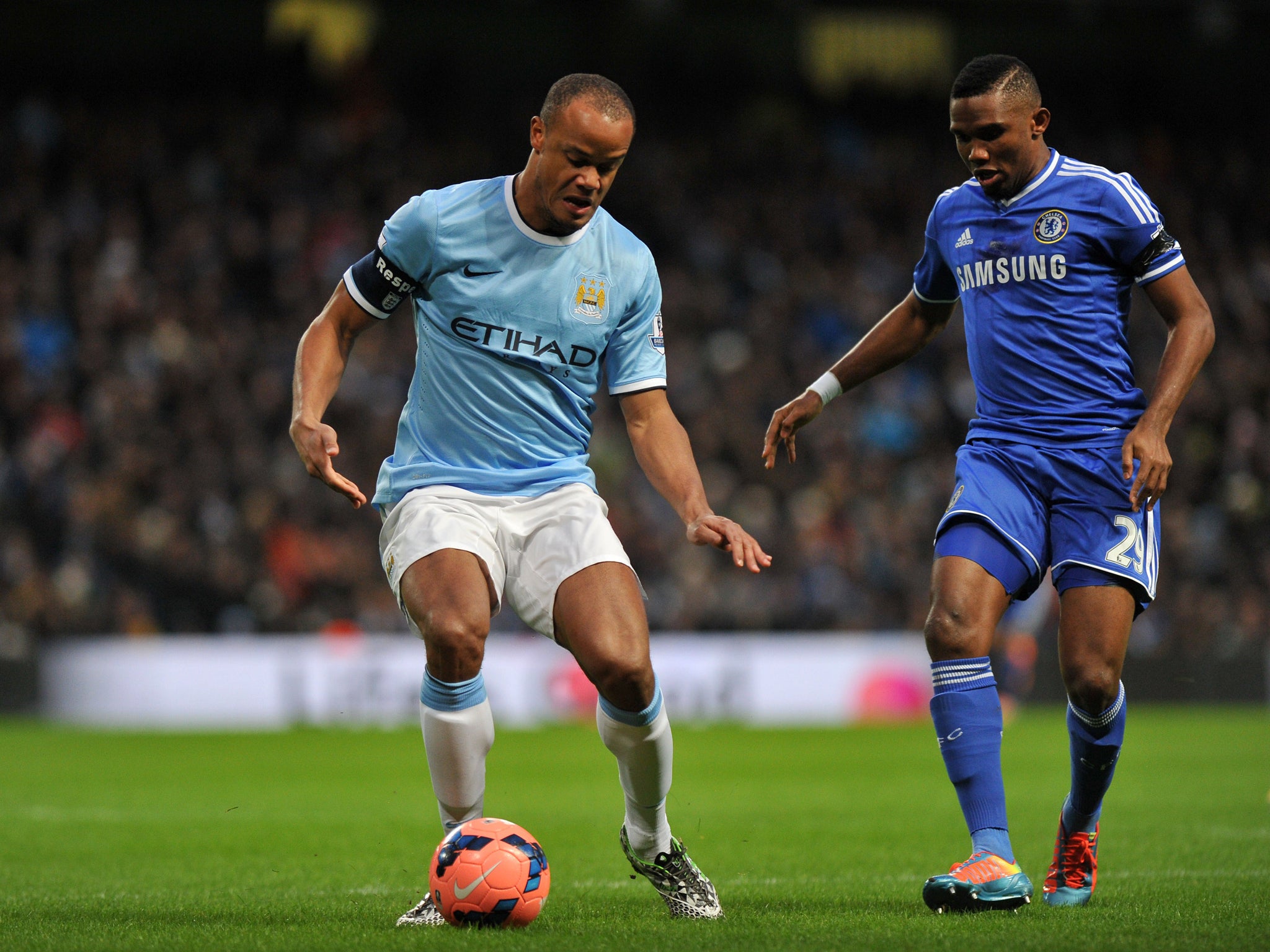 Vincent Kompany protects the ball from Chelsea striker Samuel Eto'o