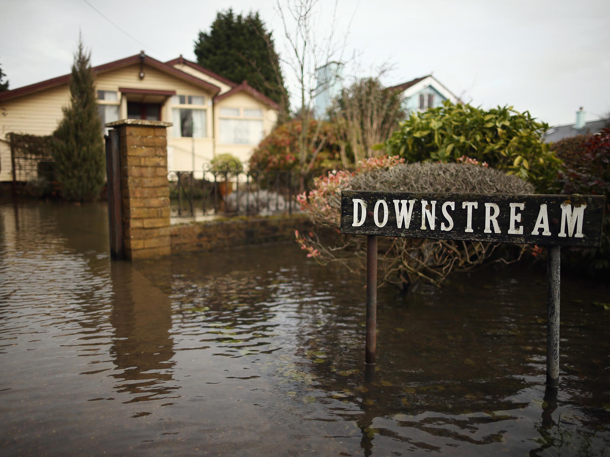 A flooded driveway to a house in Chertsey