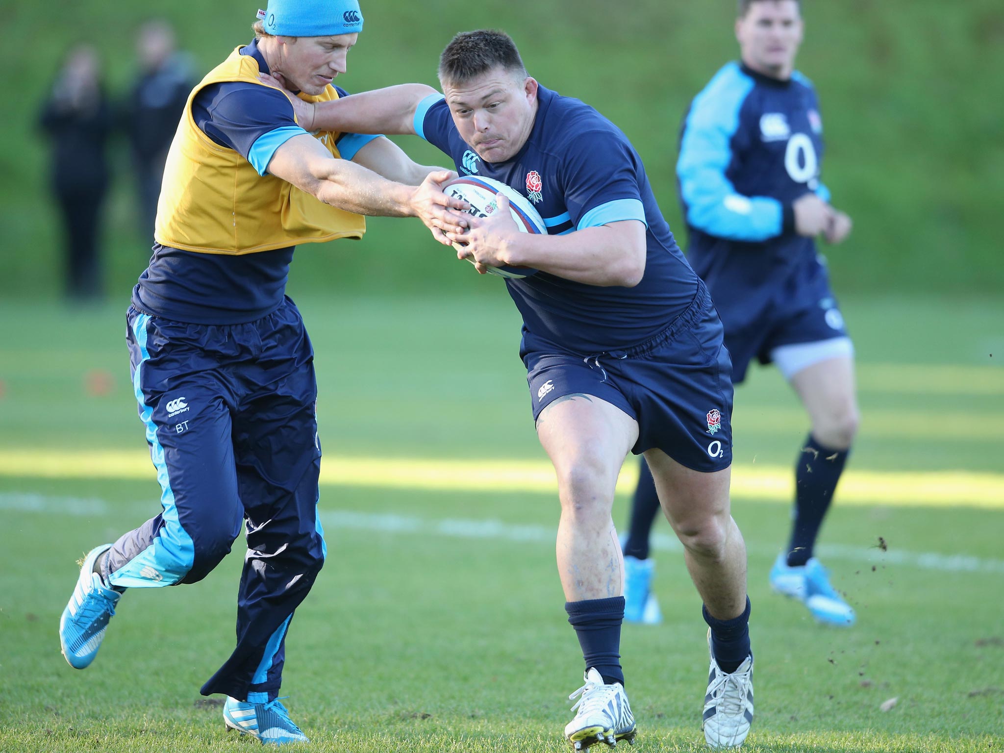 David Wilson (left) holds off Billy Twelvetrees during England training