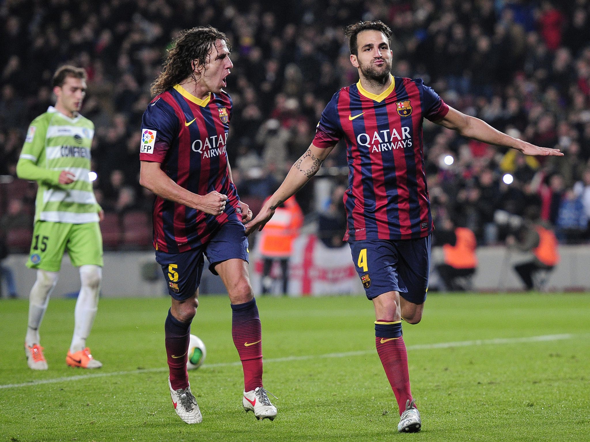 Cesc Fabregas (right) celebrates scoring against Getafe in the Copa del Rey last month