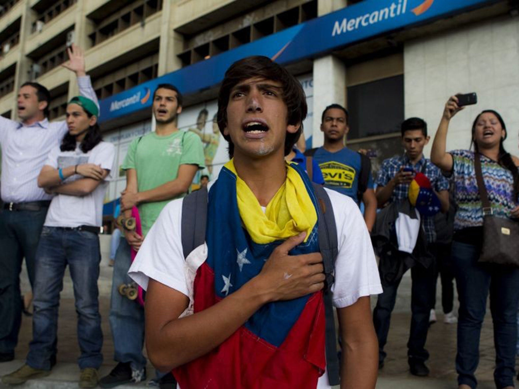 Anti-government protesters in Caracas yesterday