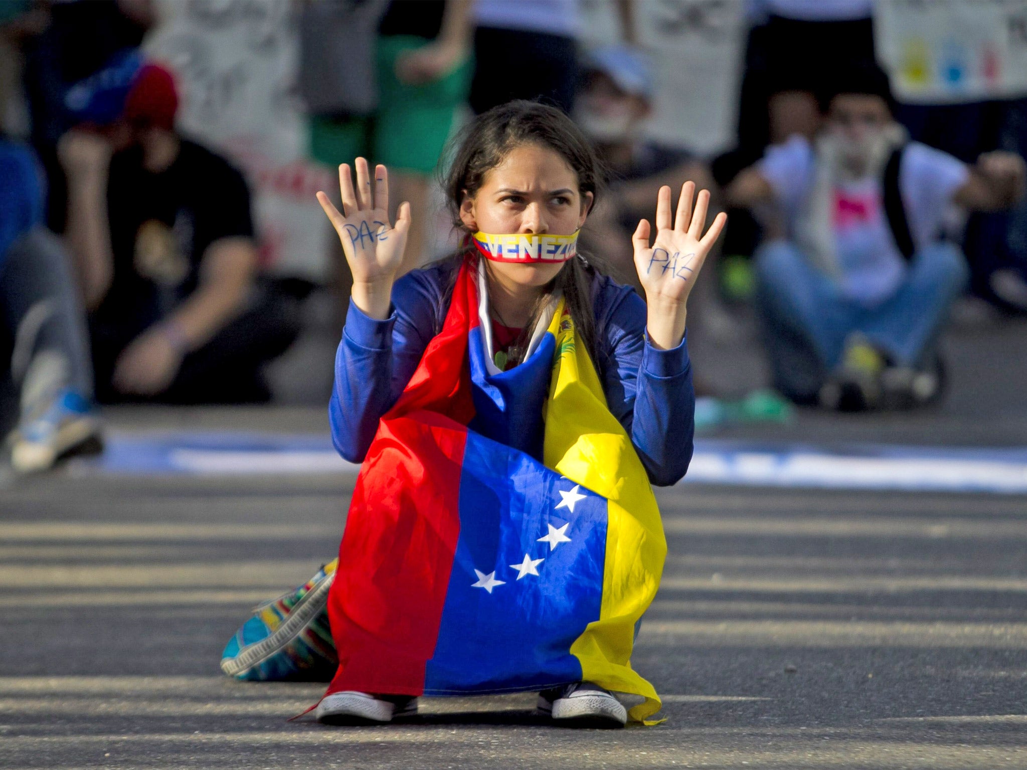 A student takes part in a protest against Nicolas Maduro’s government in Caracas