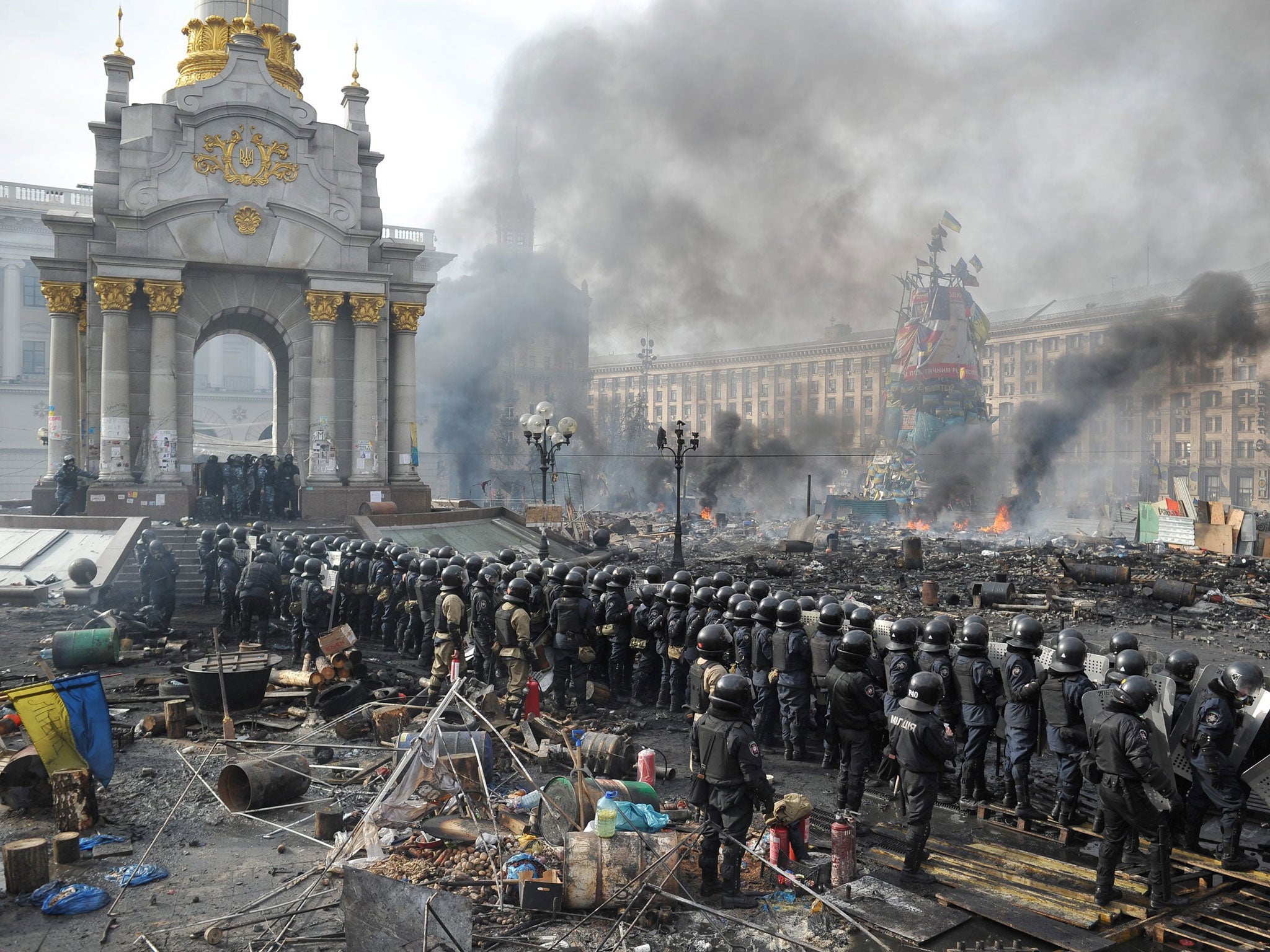 Riot police line up against anti-government protesters in Independence Square in central Kiev. More than 600 police and protesters have been injured