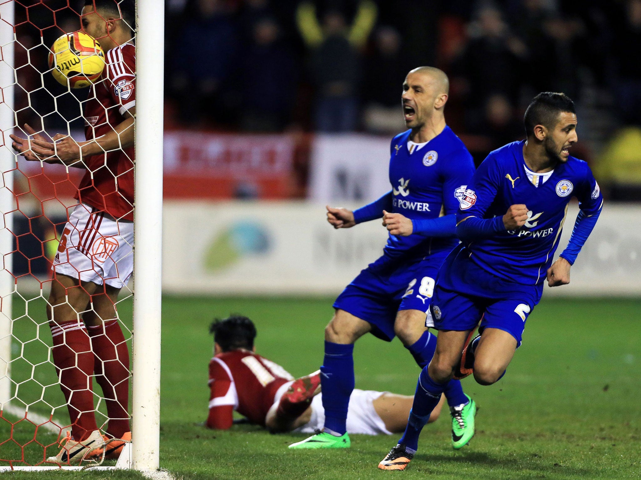 Leicester City's Riyad Mahrez, right, celebrates scoring the equaliser goal on the rebound from Kevin Phillips missed penalty during 2.2 draw against Nottingham Forest