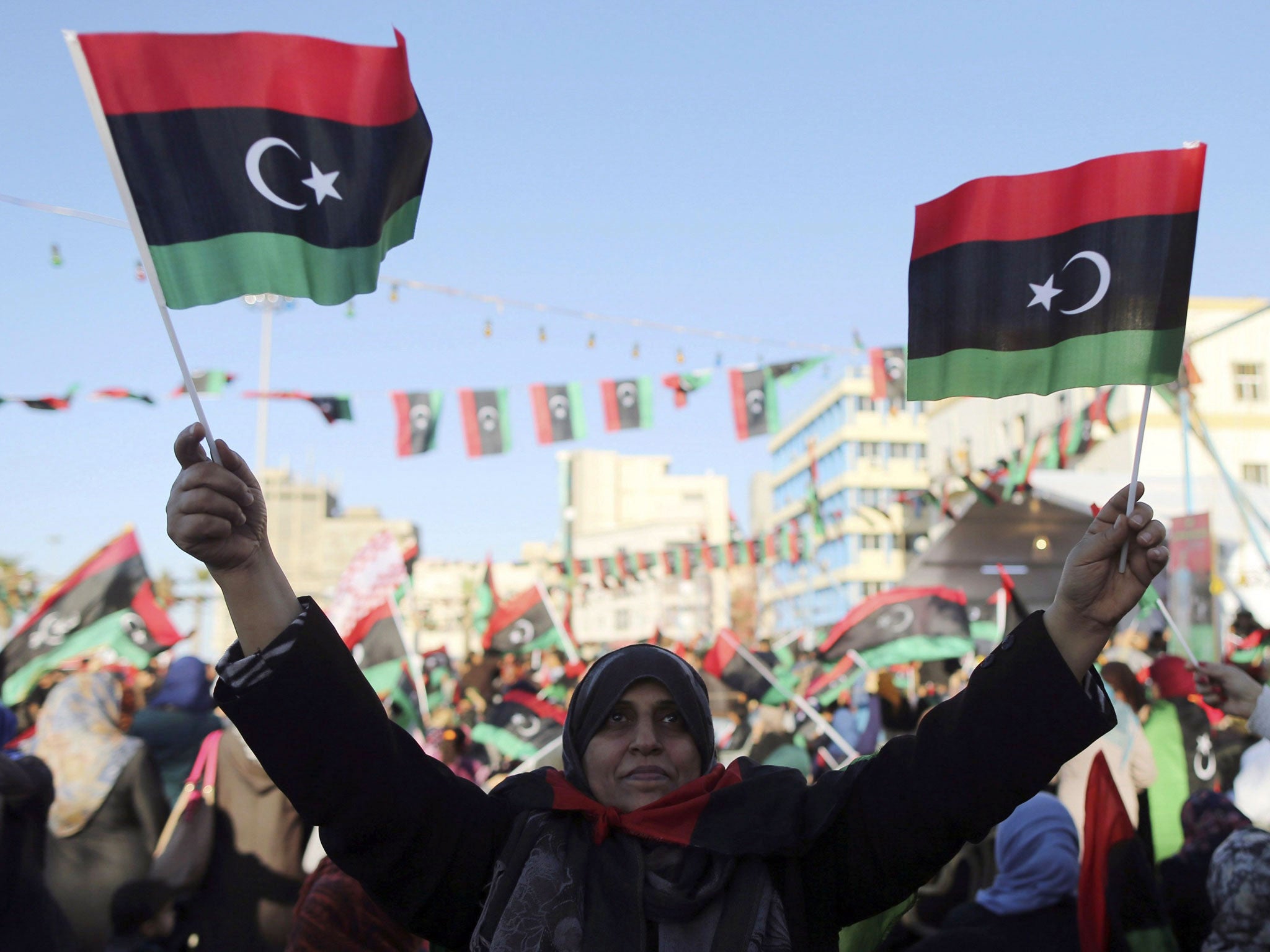 Libyans celebrate the third anniversary of the uprising against Muammar Gaddafi at Freedom Square in Benghazi