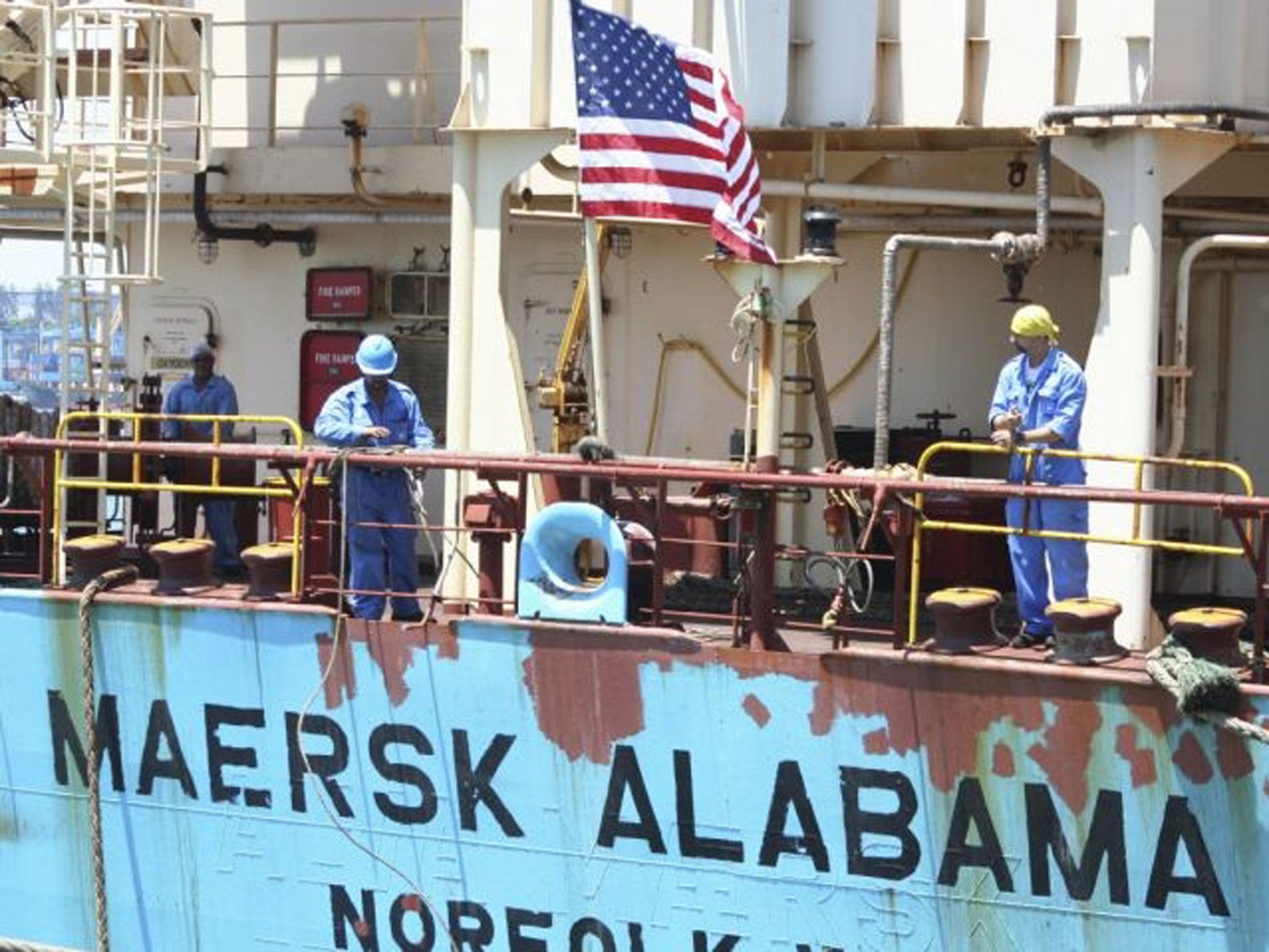 Crew members work aboard the US-flagged Maersk Alabama.