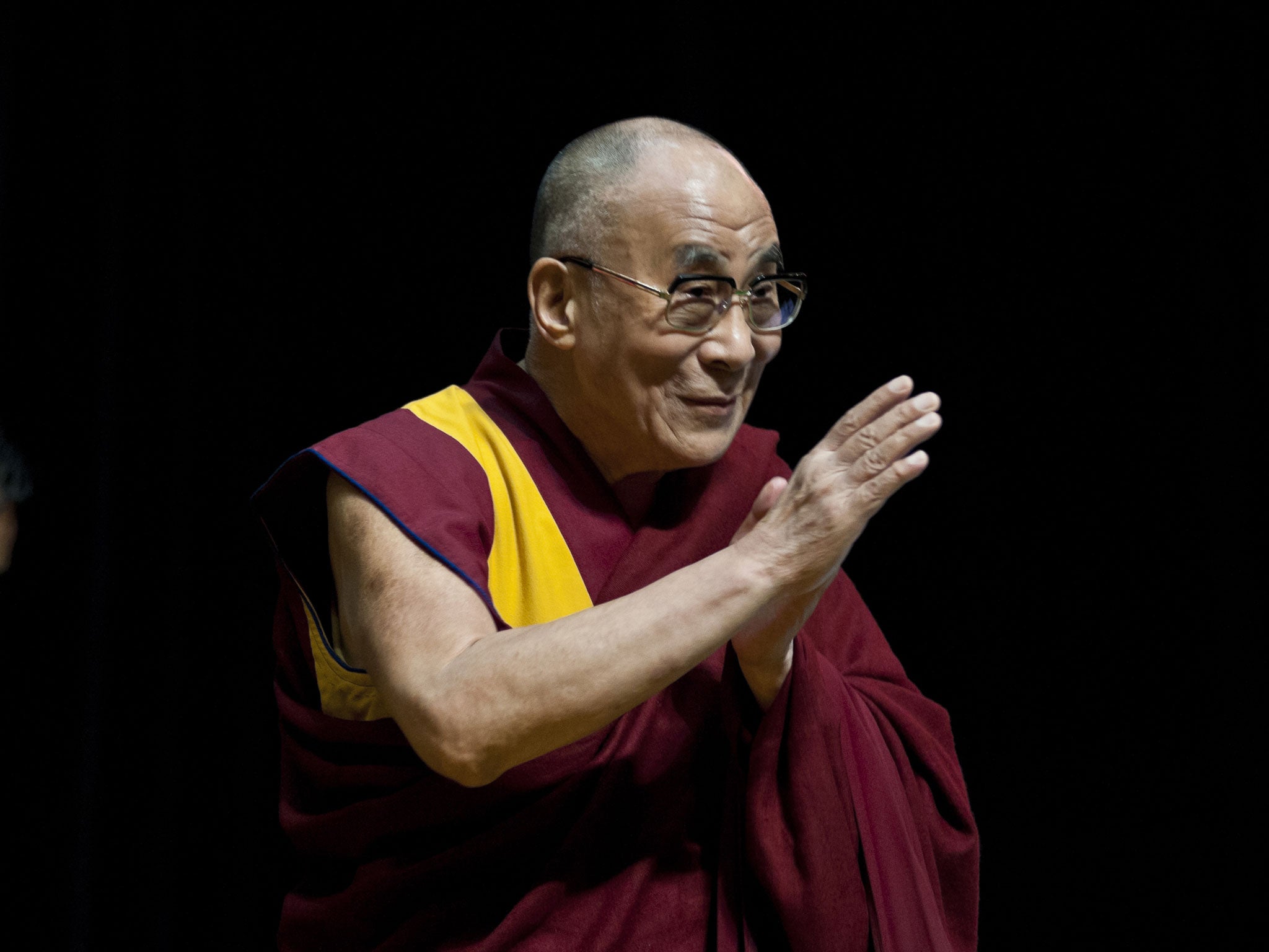 Tibetan spiritual leader the Dalai Lama is introduced to guests during the Conversations with His Holiness the Dalai Lama at Ryogoku Kokugikan on November 25, 2013 in Tokyo, Japan. The Dalai Lama spoke with guests on 'Making the best use of the wisdom of