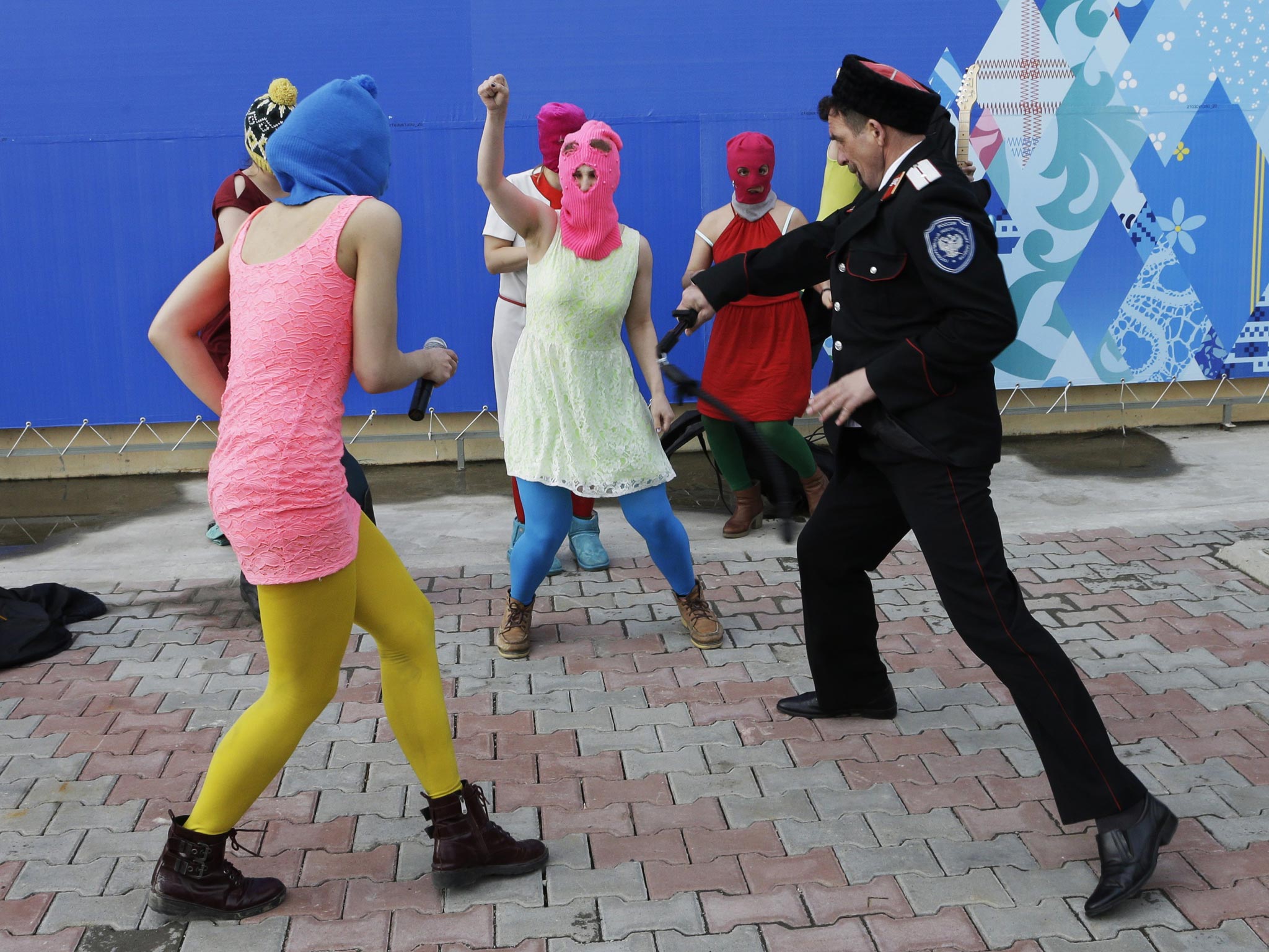 Members of the punk group Pussy Riot are attacked with whips in Sochi on Wednesday