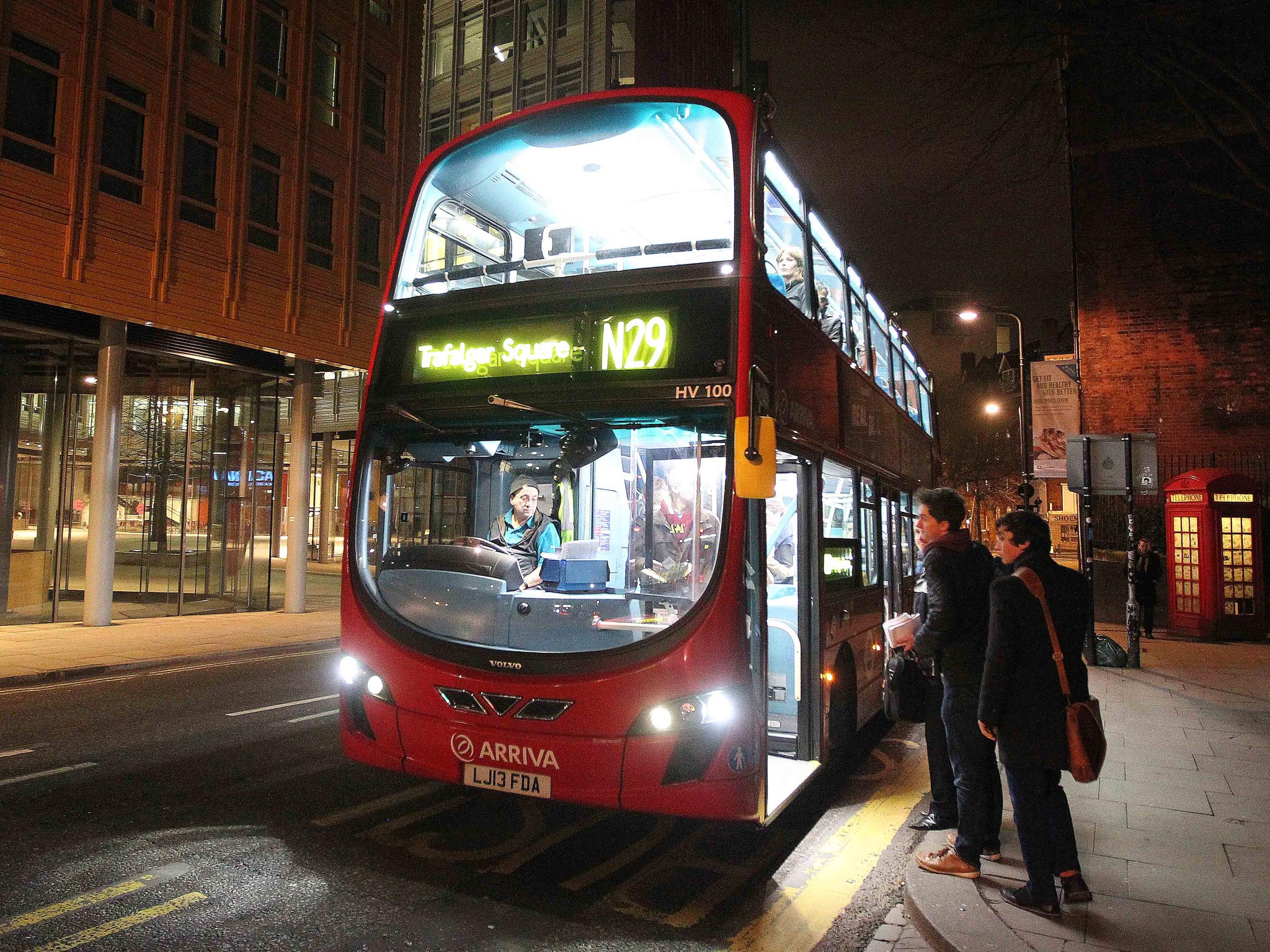 Lord Adonis quizzes passengers after boarding the N29 night bus