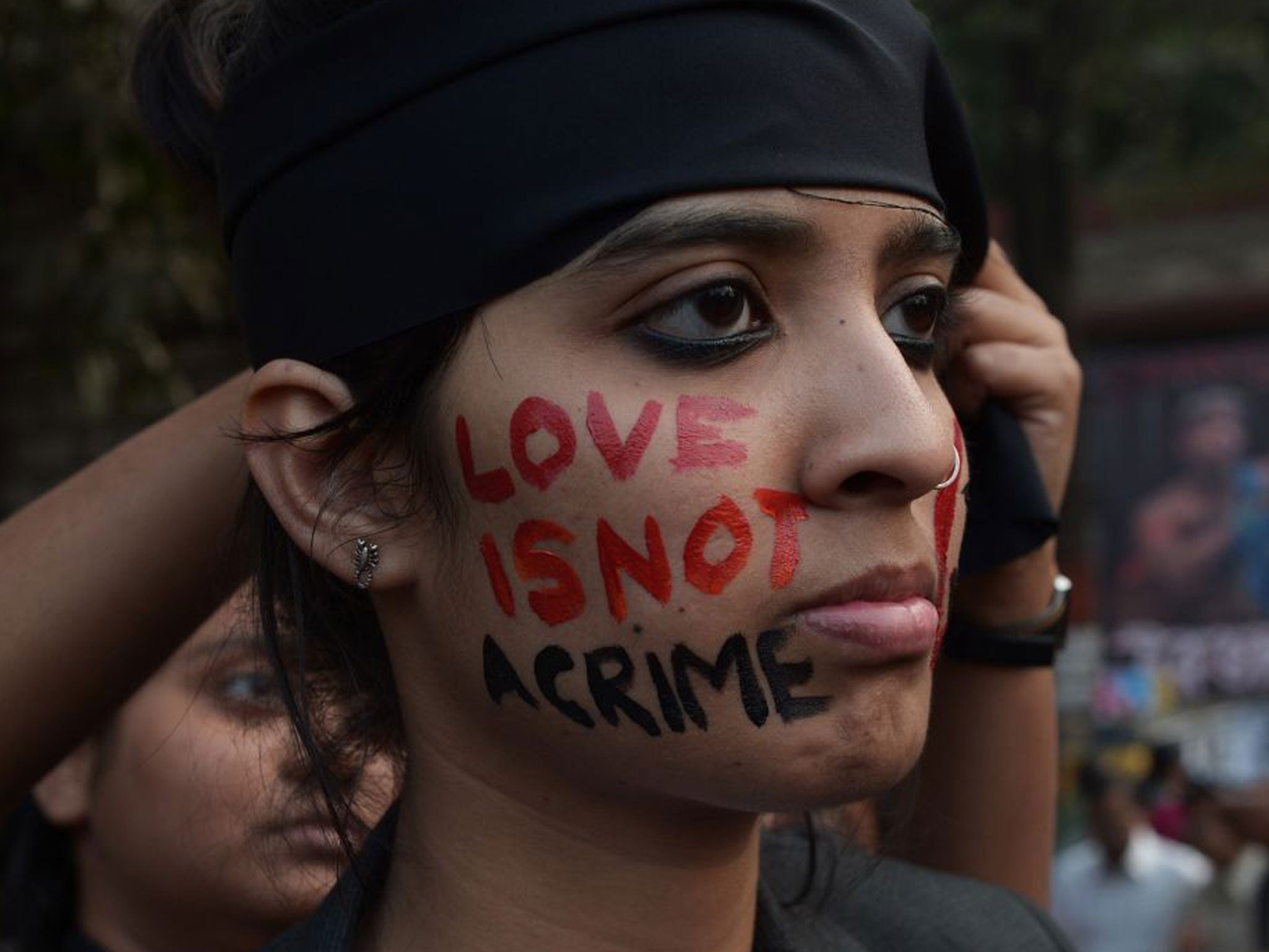 An activist during protests in Kolkata late last year, when the Supreme Court first decided to reinstate a 19th-century law criminalising homosexuality