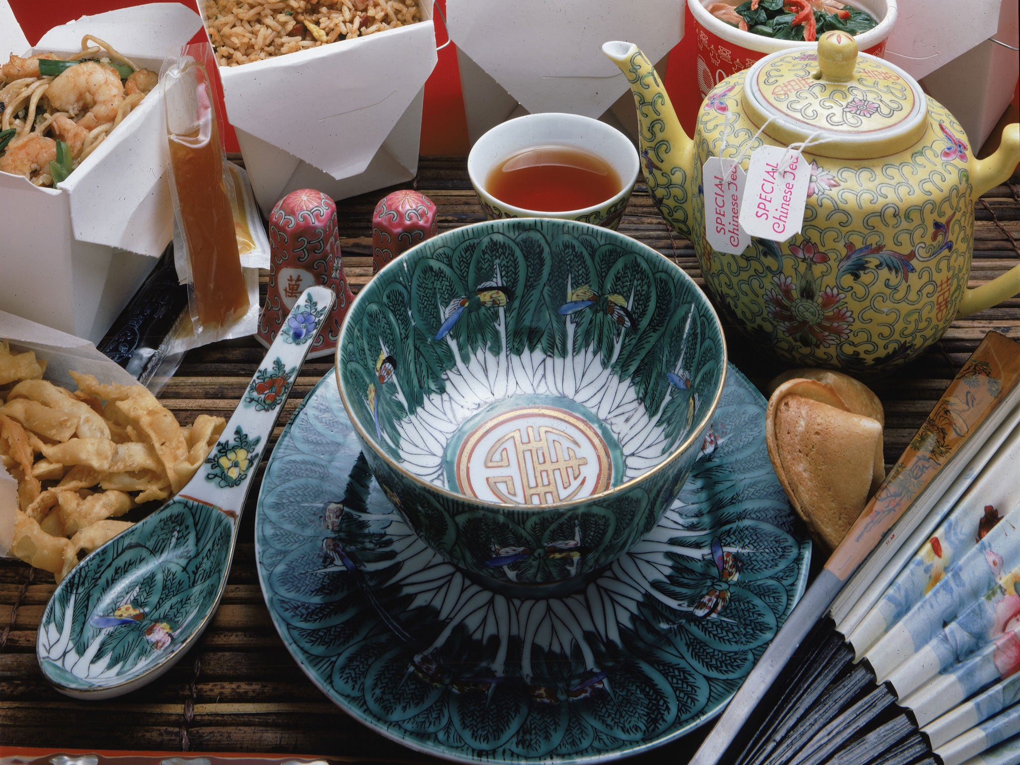 A display of Chinese take-out food and appropriate serving and eating items