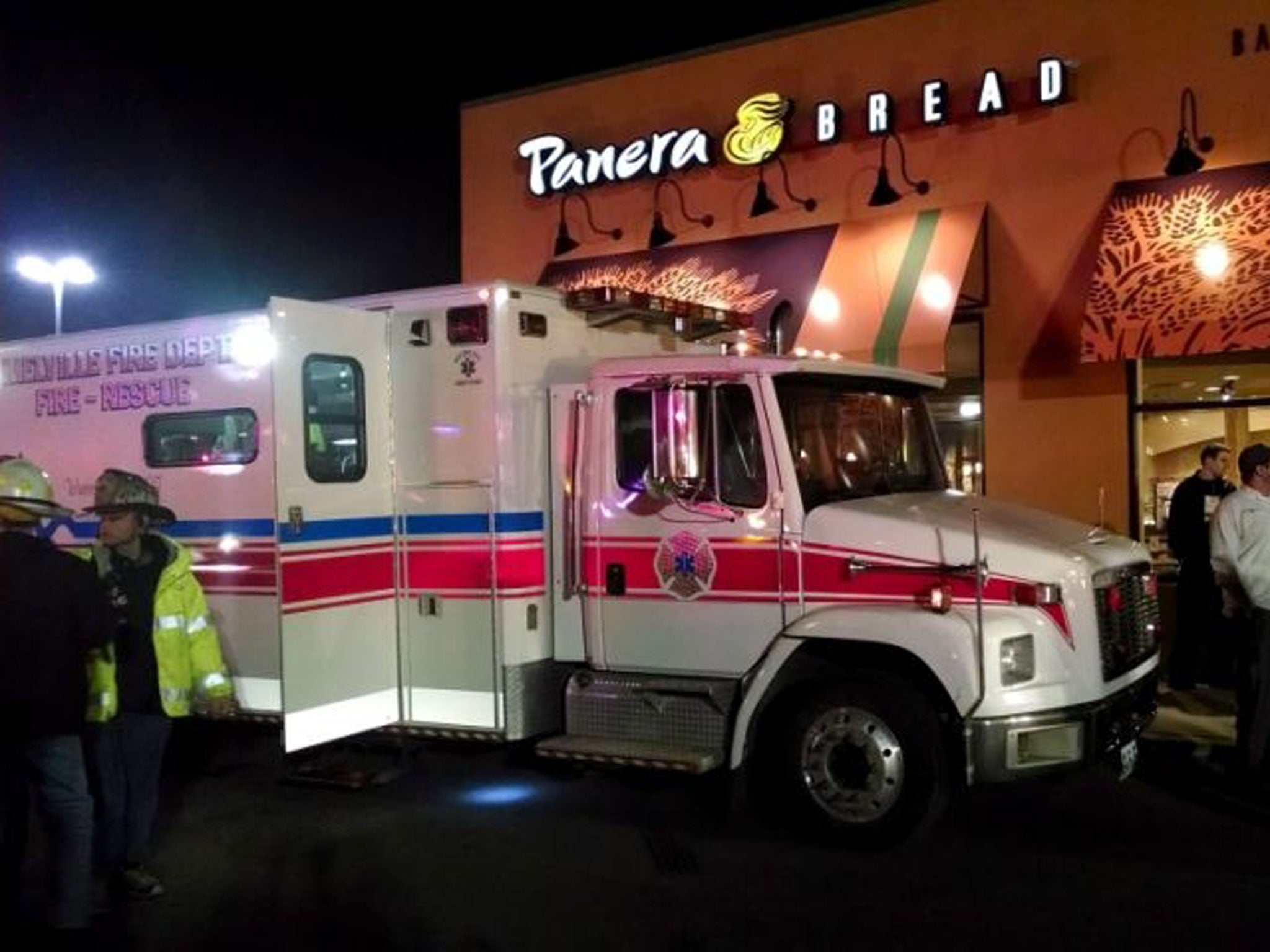 First responders stand outside Panera Bread's store at the Walt Whitman Mall in Huntington Long Island, New York late Saturday where a 55-year-old restaurant manager has died after being overcome by carbon monoxide.