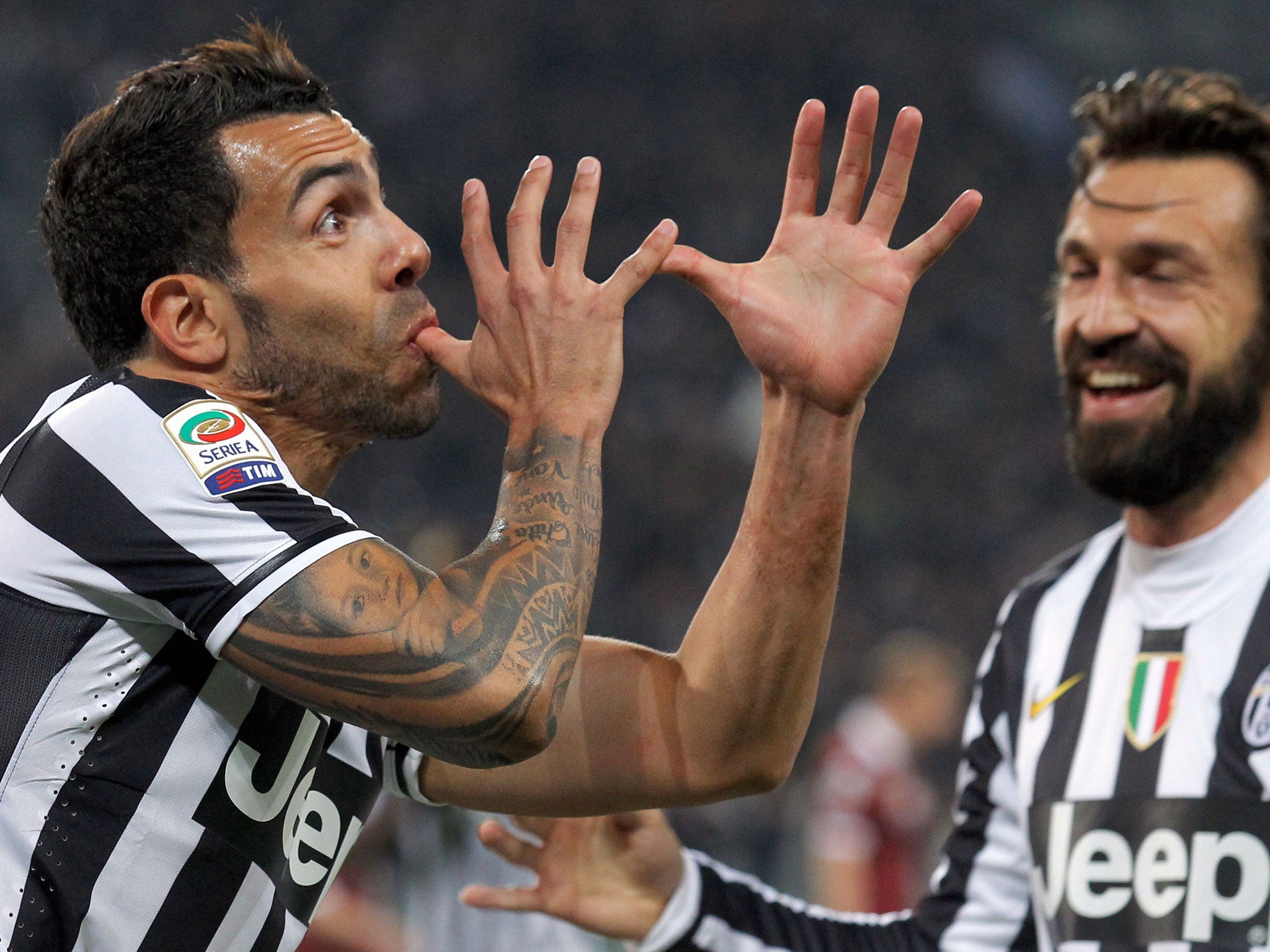 Juventus' Argentine forward Carlos Tevez celebrates after scoring for Juventus earlier this season