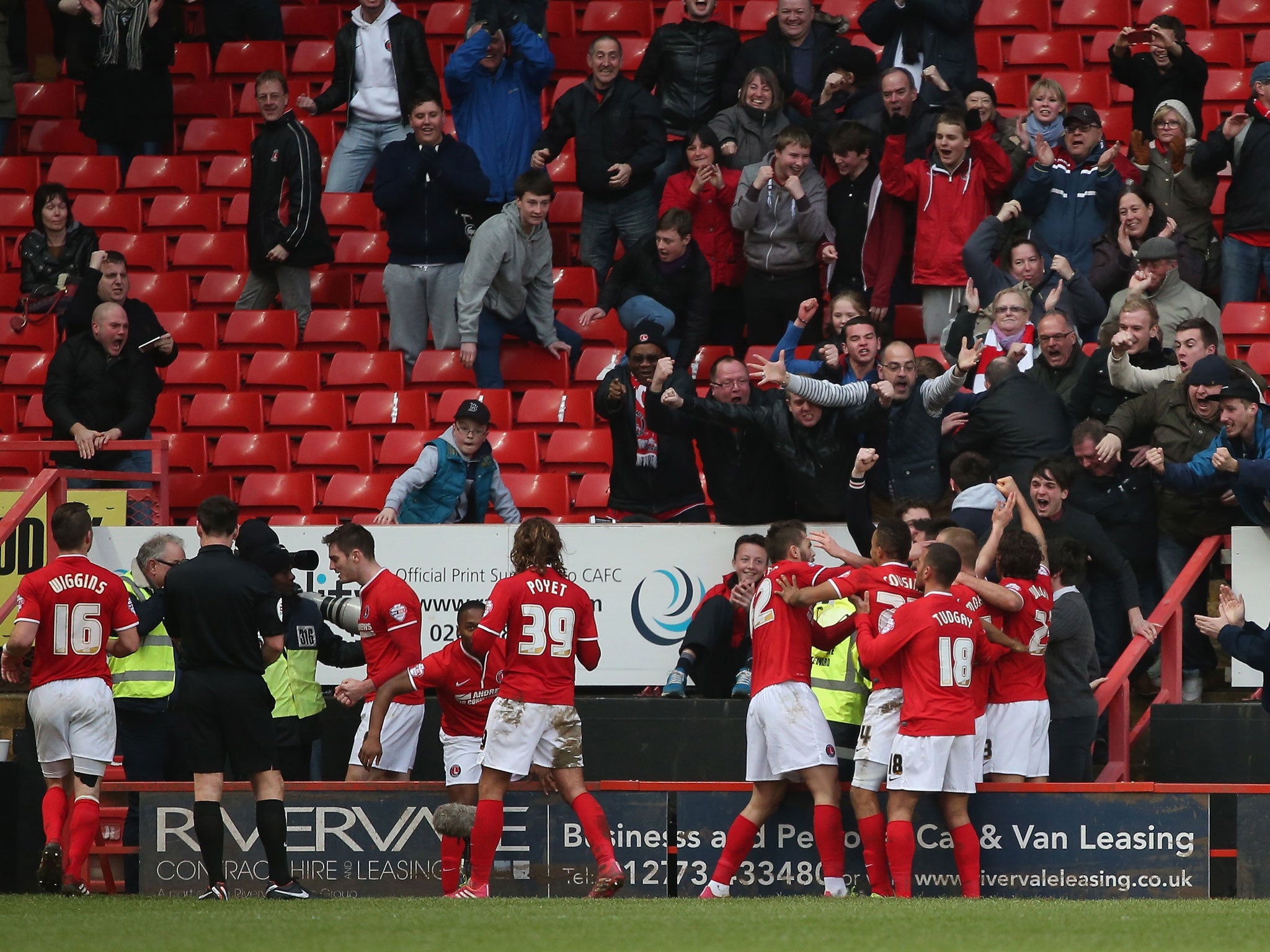 Charlton fans celebrate Johnnie Jackson's goal in the Championship clash with QPR