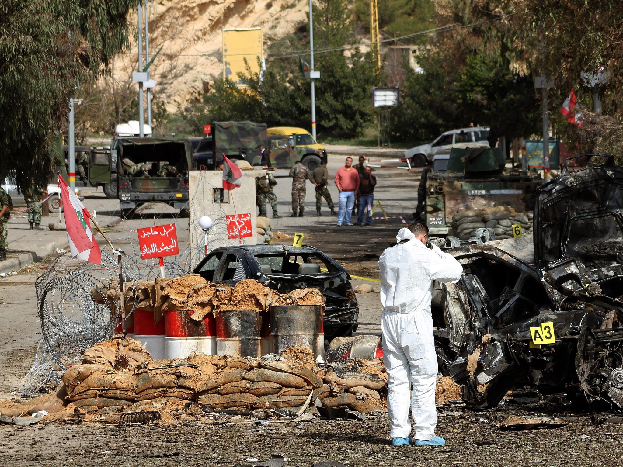 The aftermath of a suicide bombing which killed three people and injured 15 near a Lebanese army checkpoint in Hermel, north-east Lebanon, last week