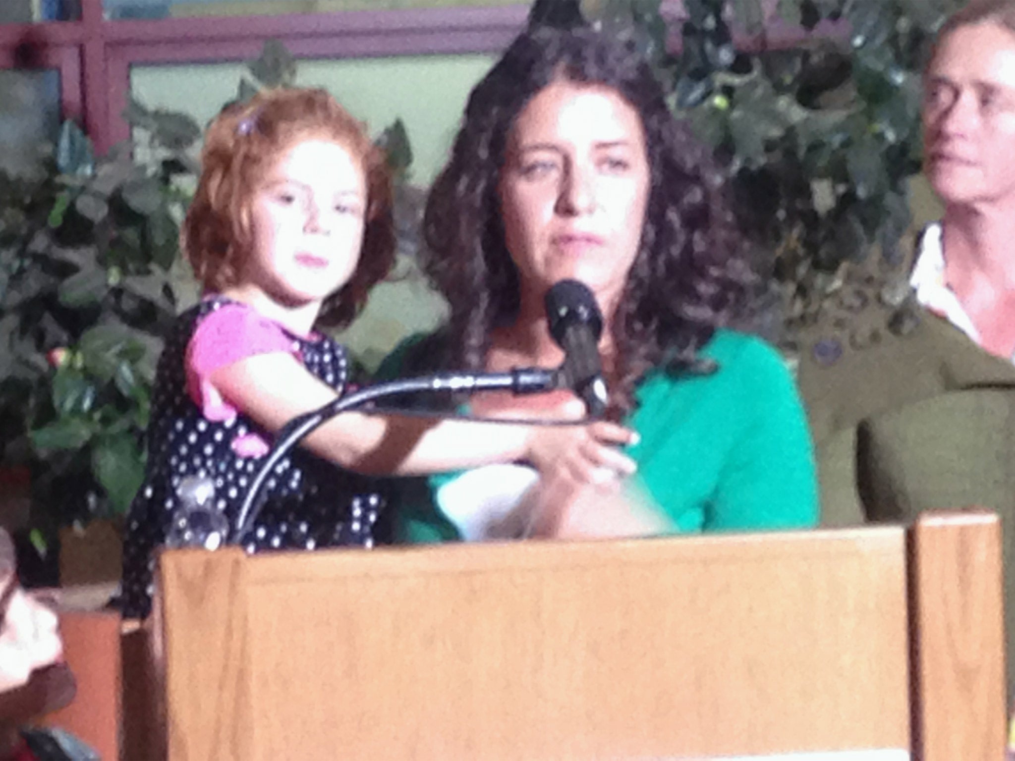 Jessica Tomei holds her 4-year-old daughter, Sofia Jarvis, during a news conference at Lucille Packard Children's Hospital at Stanford University