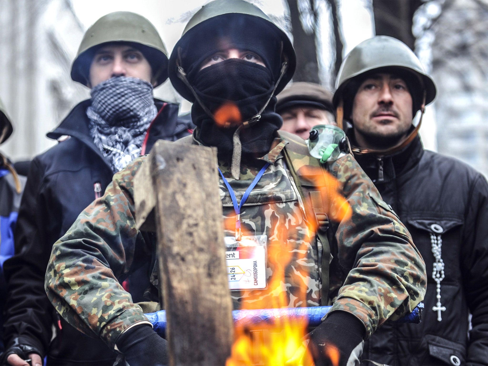 Anti-government protesters in front of a parliamentary building in Kiev