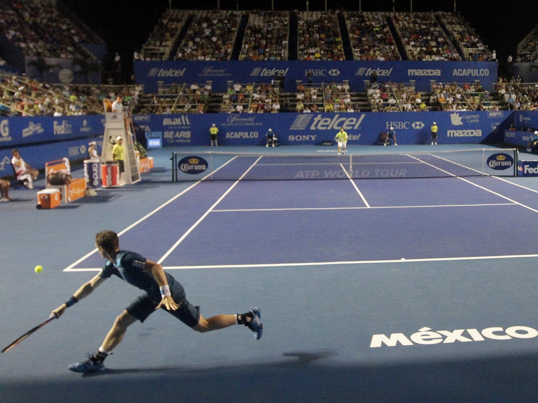 Andy Murray (L) returns the ball to Pablo Andujar of Spain during the Mexico ATP Open men's single tennis match, in Acapulco, Guerrero state