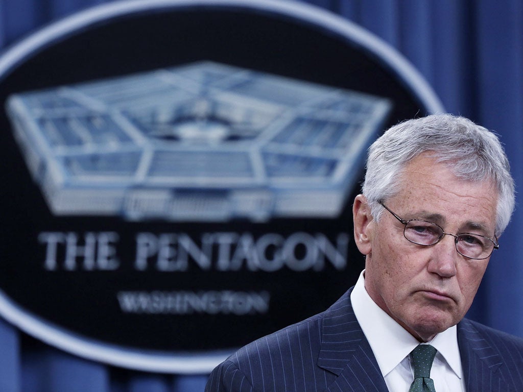 Secretary of Defense Chuck Hagel listens during a press conference British Secretary of State for Defense Philip Hammond at the Pentagon May 2, 2013 in Arlington, Virginia.