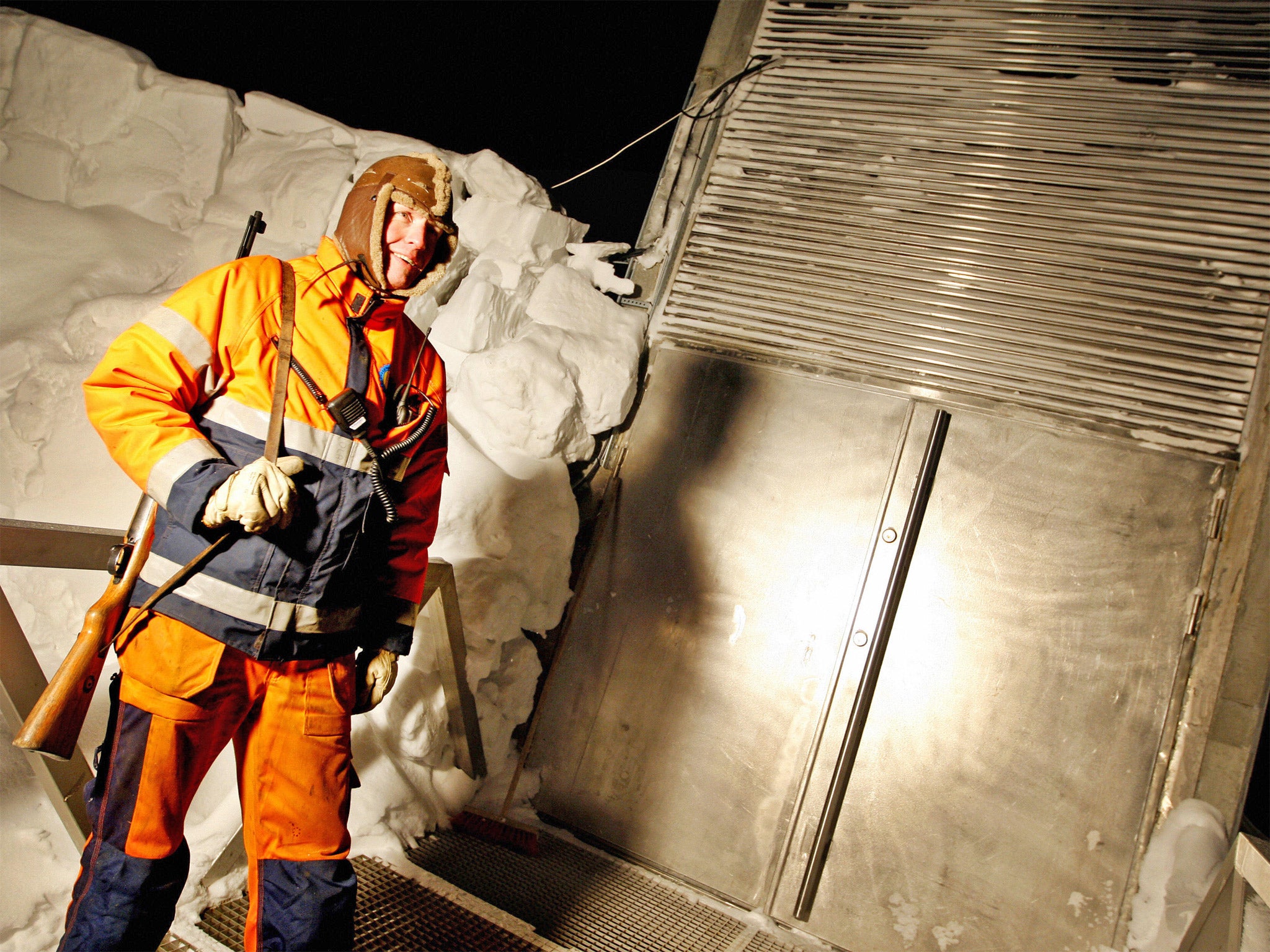 An armed guard stands outside the entrance to the 'Doomsday Vault' (Getty)