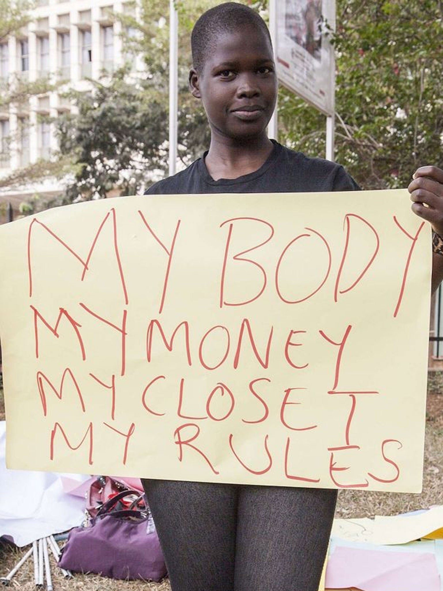 A woman protests against the new anti-pornography and dress code legislation.