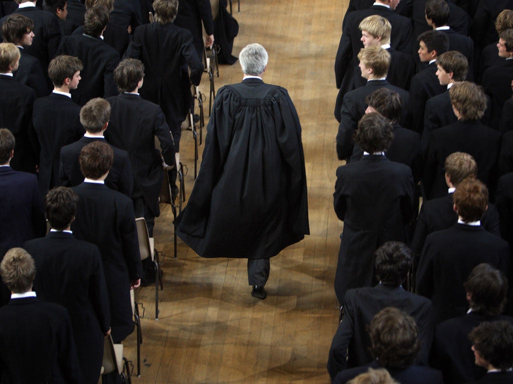 The boys of Eton College stand as headmaster Tony Little arrives for morning assembly on September 6, 2007 in Eton, England.