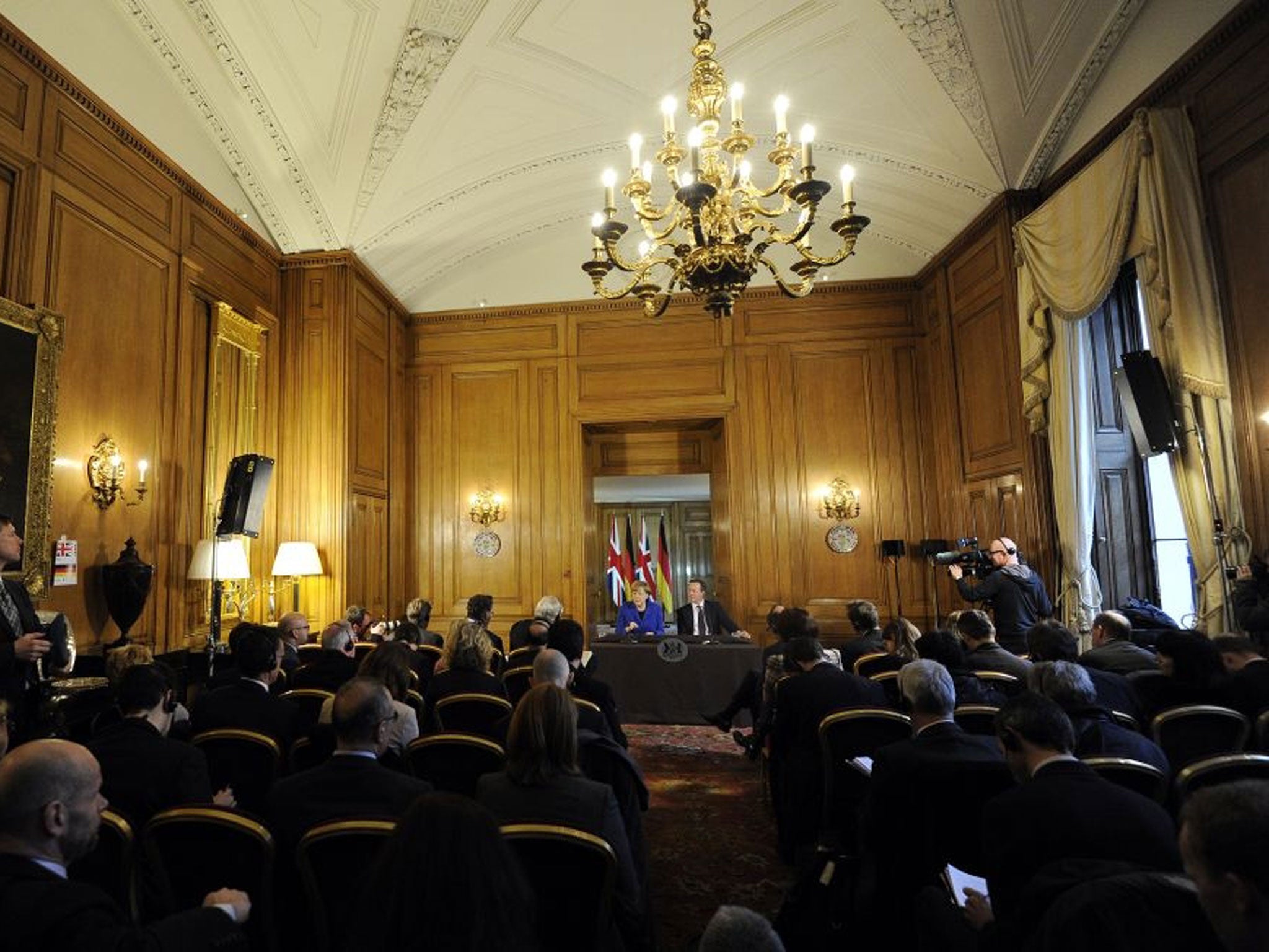 British Prime Minister, David Cameron (R) and German Chancellor Angela Merkel (L) attend a joint press conference at 10 Downing Street.