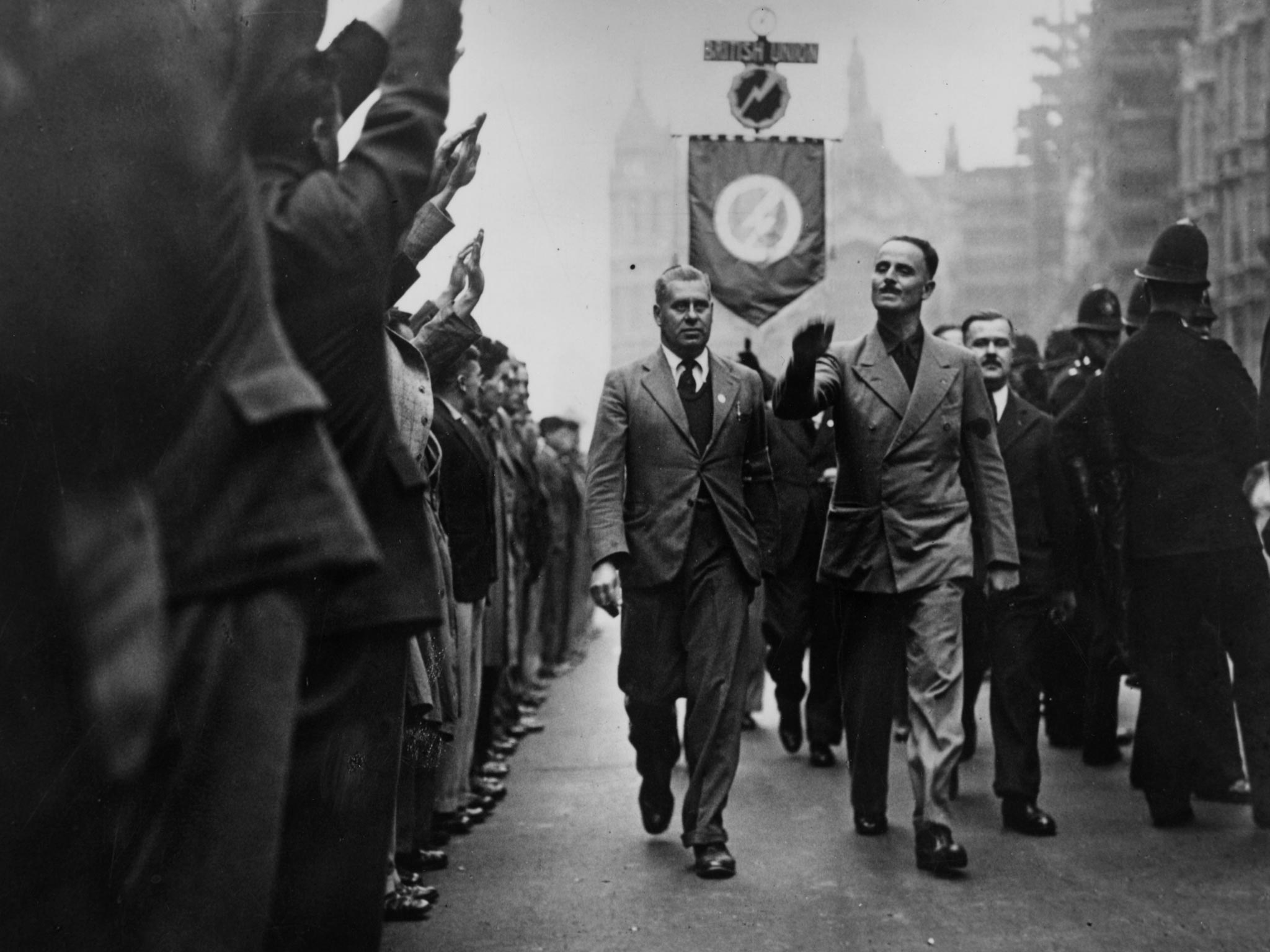 3rd October 1937: British fascist politician Sir Oswald Ernald Mosley returns salutes as he leads a march in London