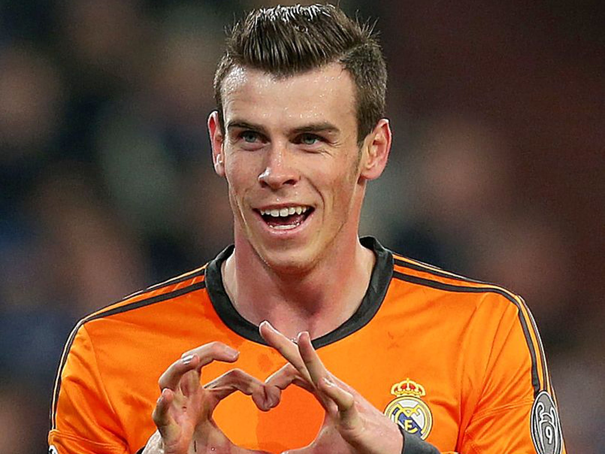 Encouraging sign: Apart from his copyrighted love-heart goal celebration, Gareth Bale is the antithesis of the modern tattoo-encrusted dilettante