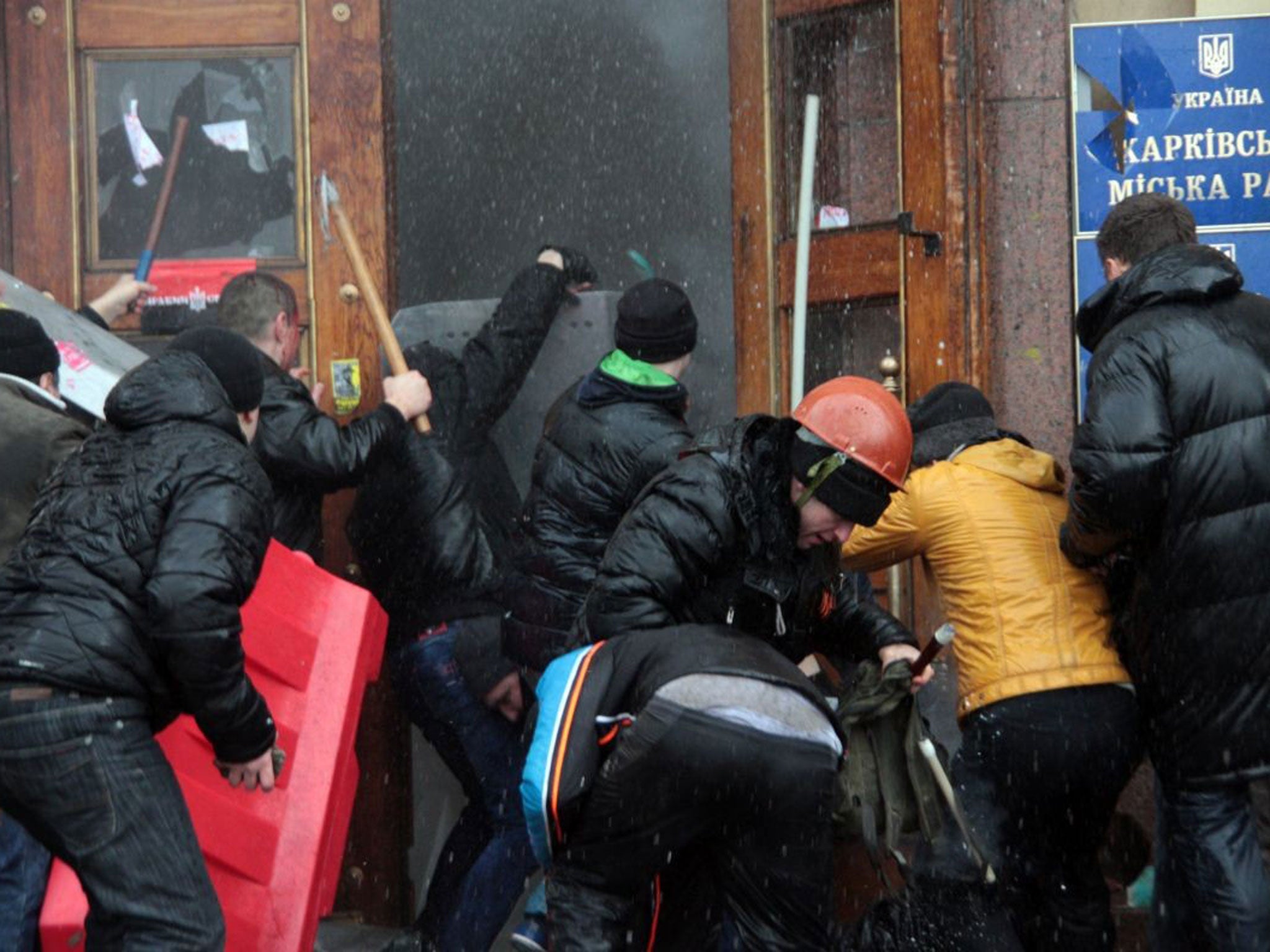 On the attack: Pro-Russia supporters in Kharkiv