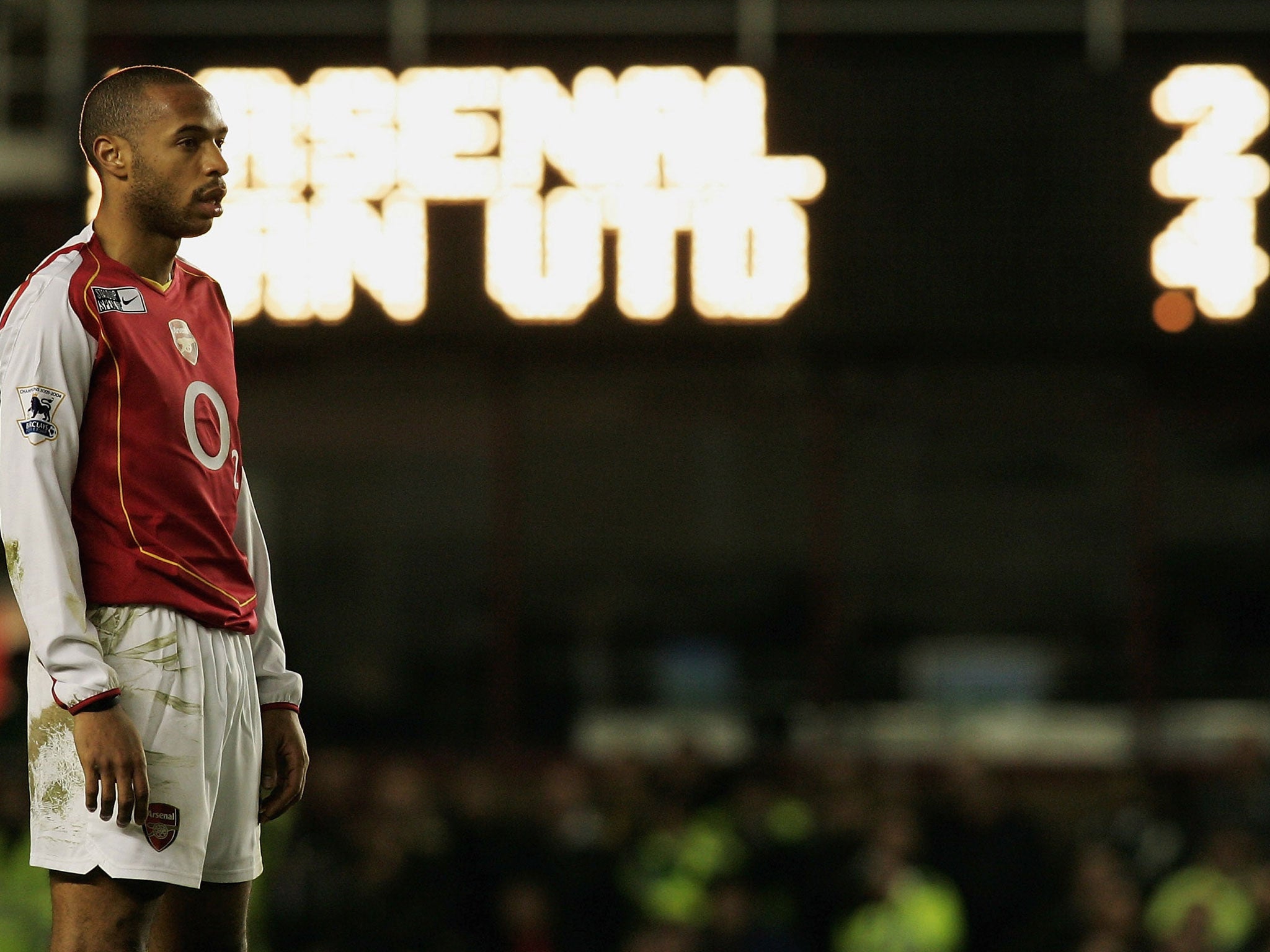 Thierry Henry looks on during the defeat against Manchester United (GETTY)