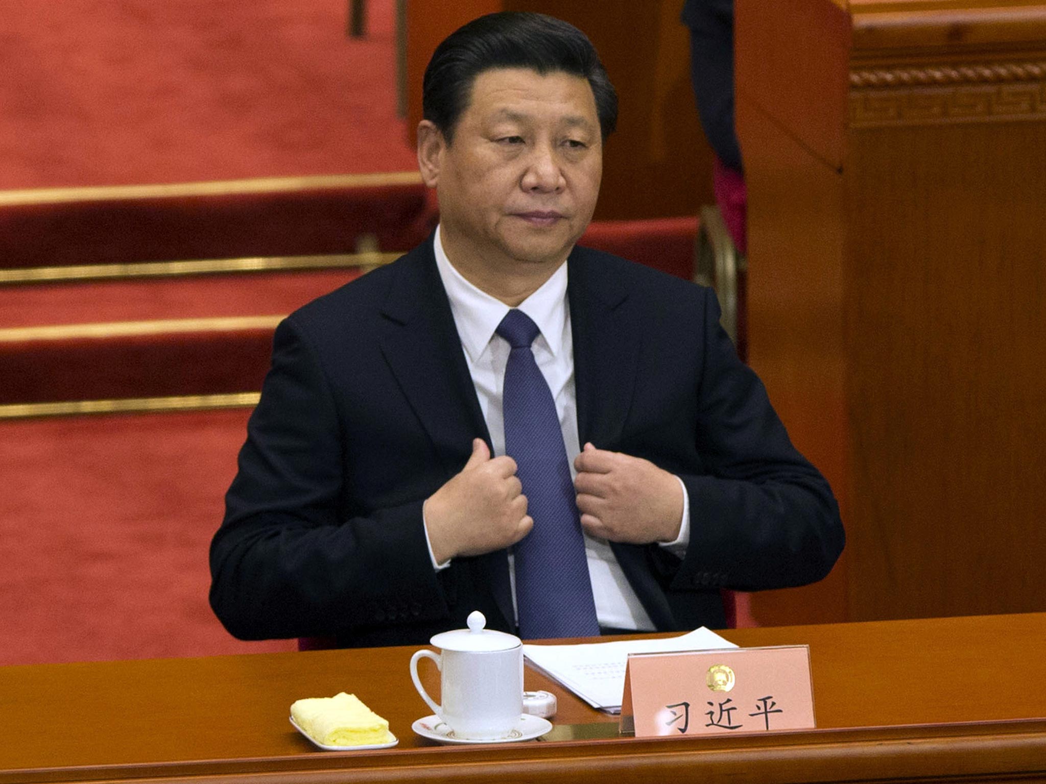 Chinese President Xi Jinping attends the opening session of the Chinese People's Political Consultative Conference in Beijing