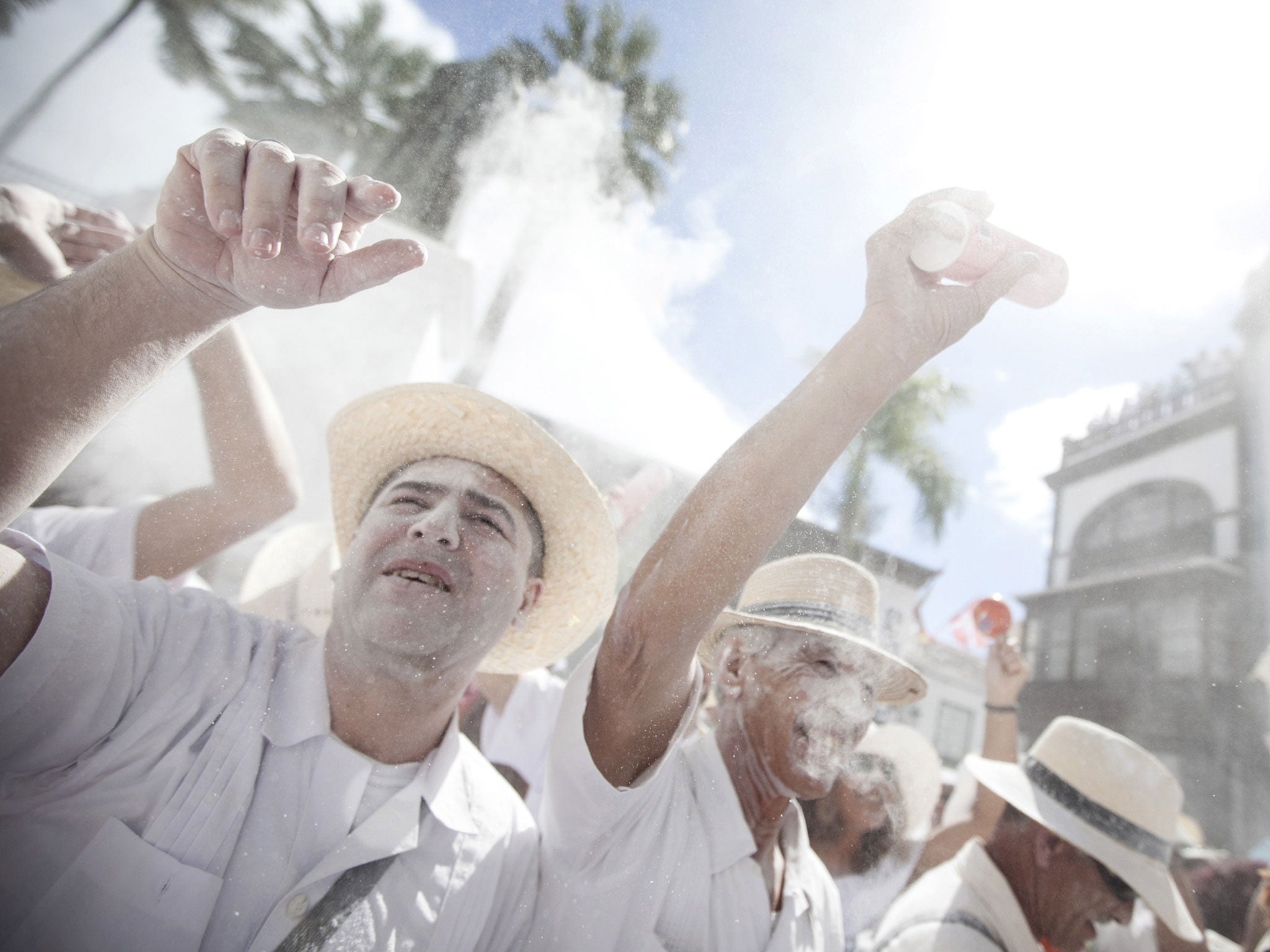 People throw vast quantities of talcum powder at each other. The town hall gives away around five tons of talcum to people in the parade, and everyone else brings at least half a kilo of their own