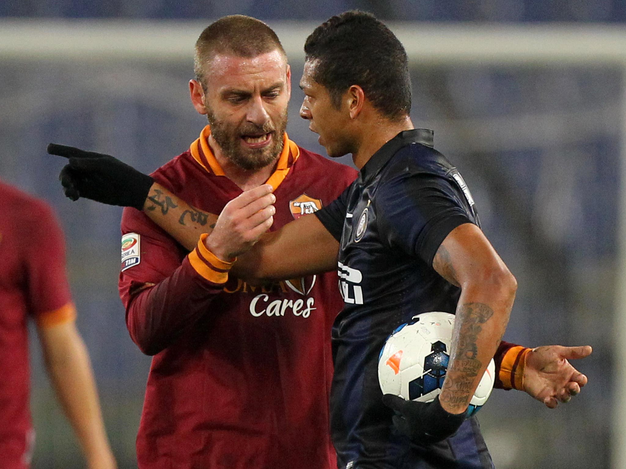 Daniele de Rossi (L) has been dropped from the Italy squad for punching Inter Milan striker Mauro Ocardi (not pictured)