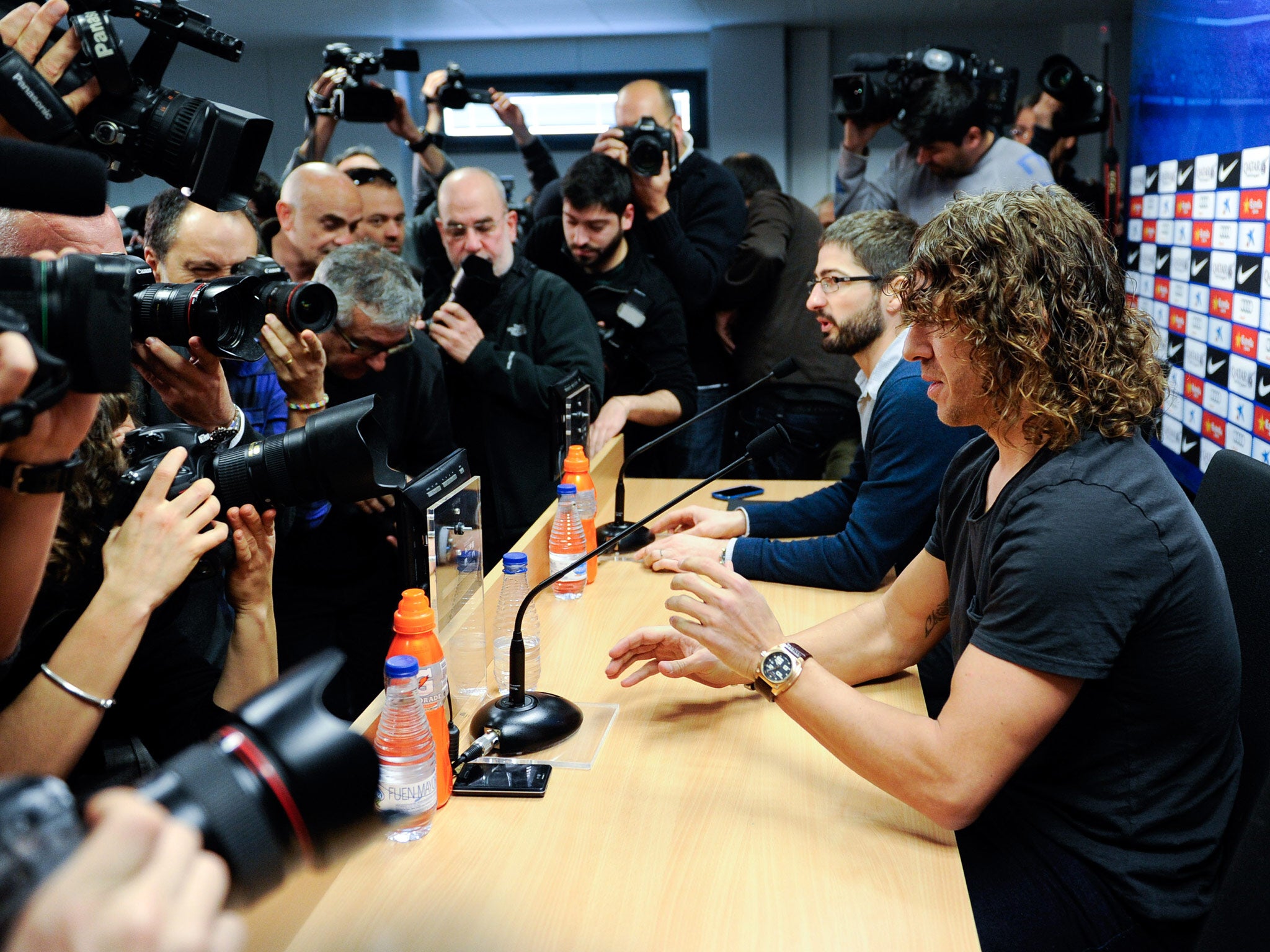 Carles Puyol of FC Barcelona faces the media during a press conference to announce he will be leaving the Catalan club at the end of the season