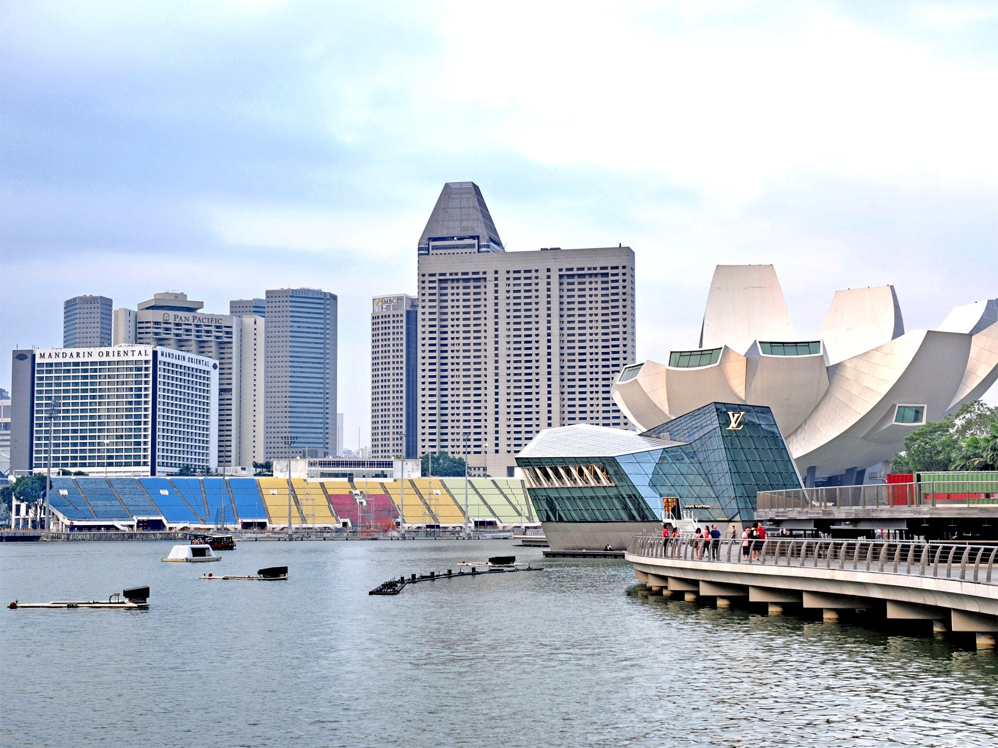 The Marina Bay promenade in Singapore. The arrival of wealthy foreigners in the booming financial centre has helped to drive up prices