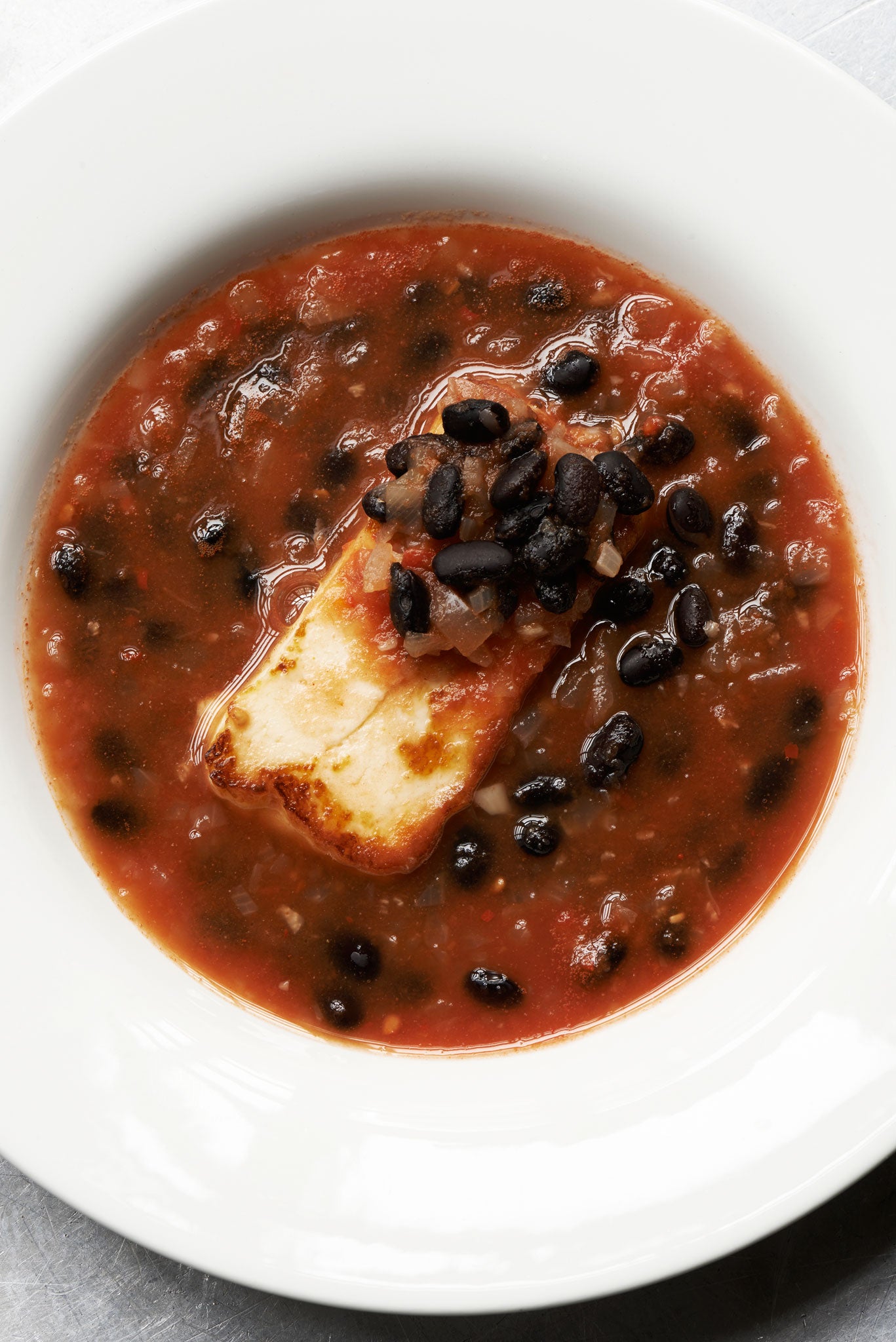 Mark serves his black bean soup with halloumi