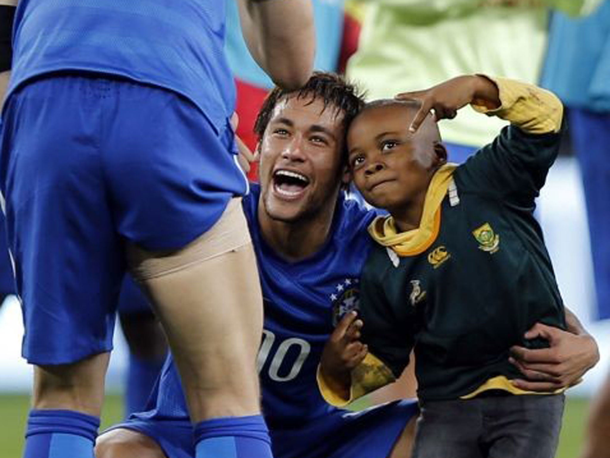 The little boy had his picture taken with the football star