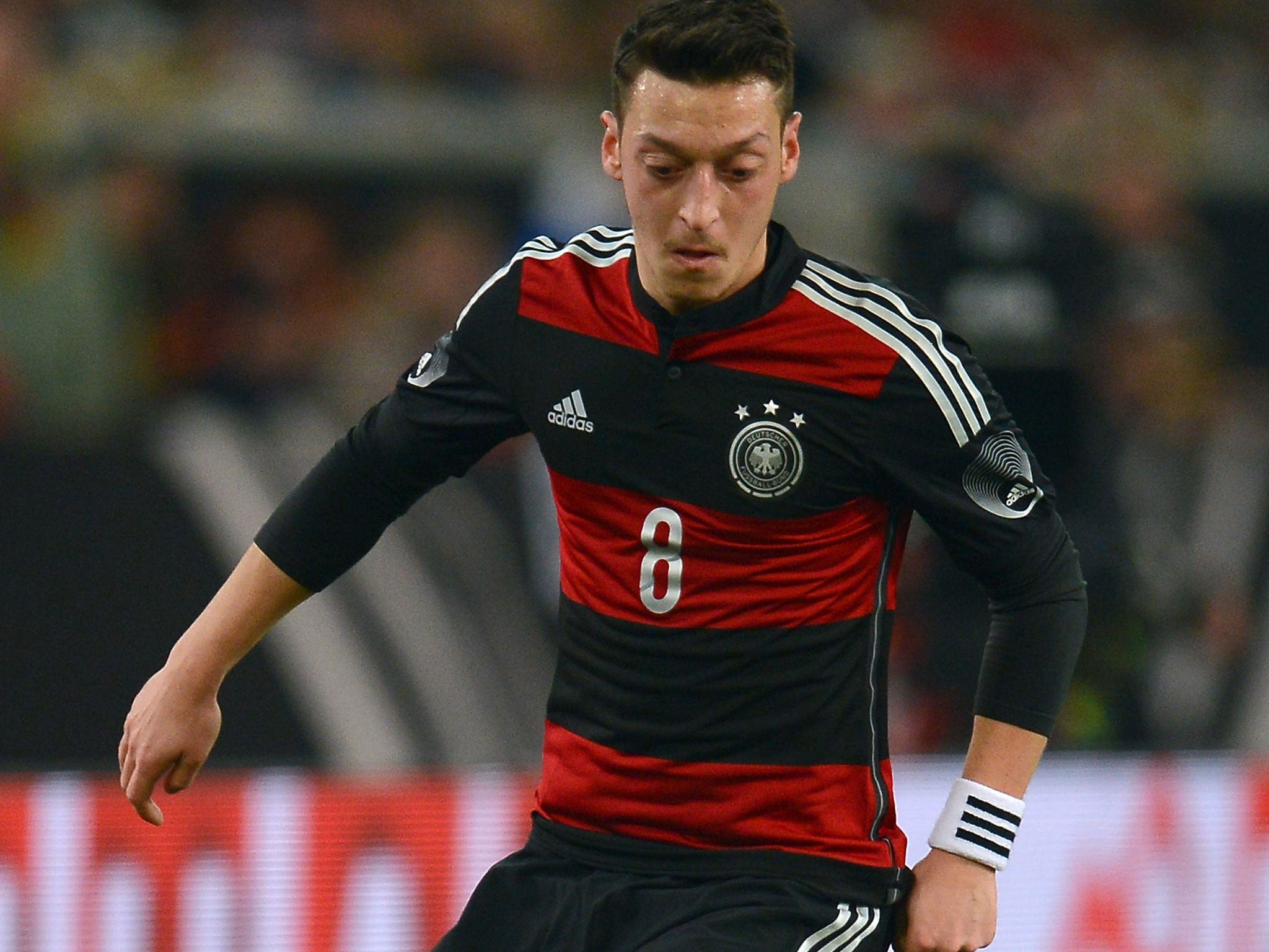 Mesut Ozil makes a pass for Germany in their 1-0 win over Chile