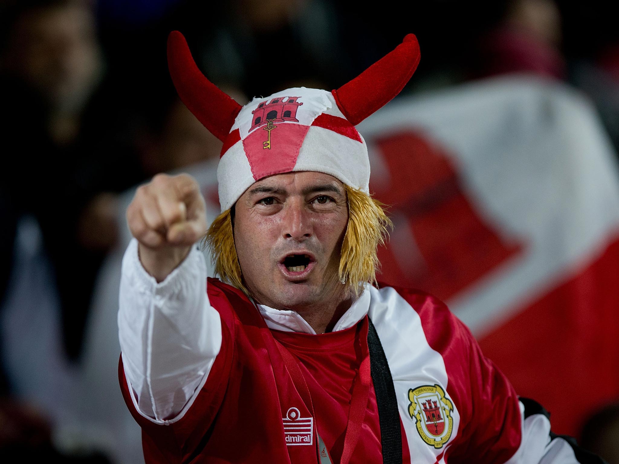 A fan urges on the team