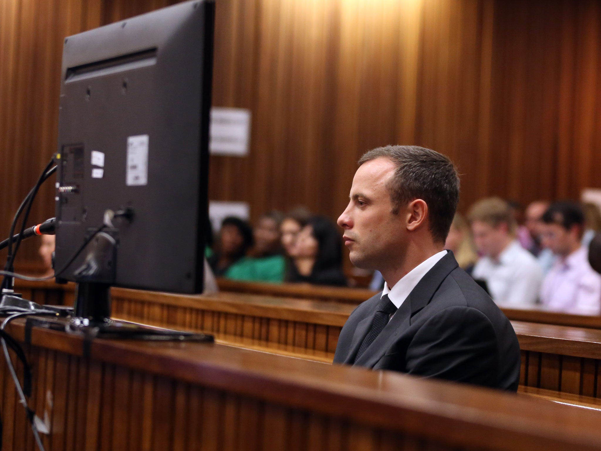 South African paralympic athlete Oscar Pistorius listens at the Pretoria's North Gauteng High Court (Getty Images)