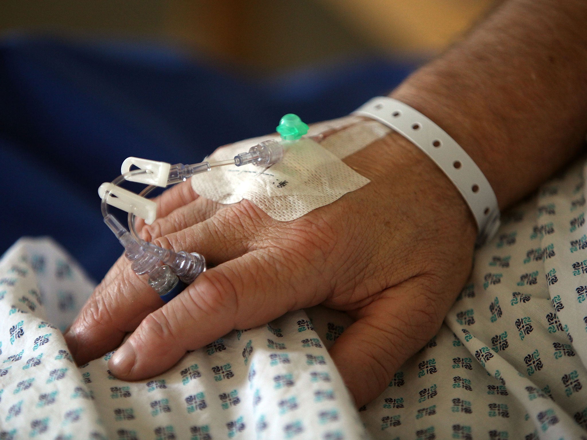 A patients, unrelated to the deaths, recovers in a hospital ward in England.