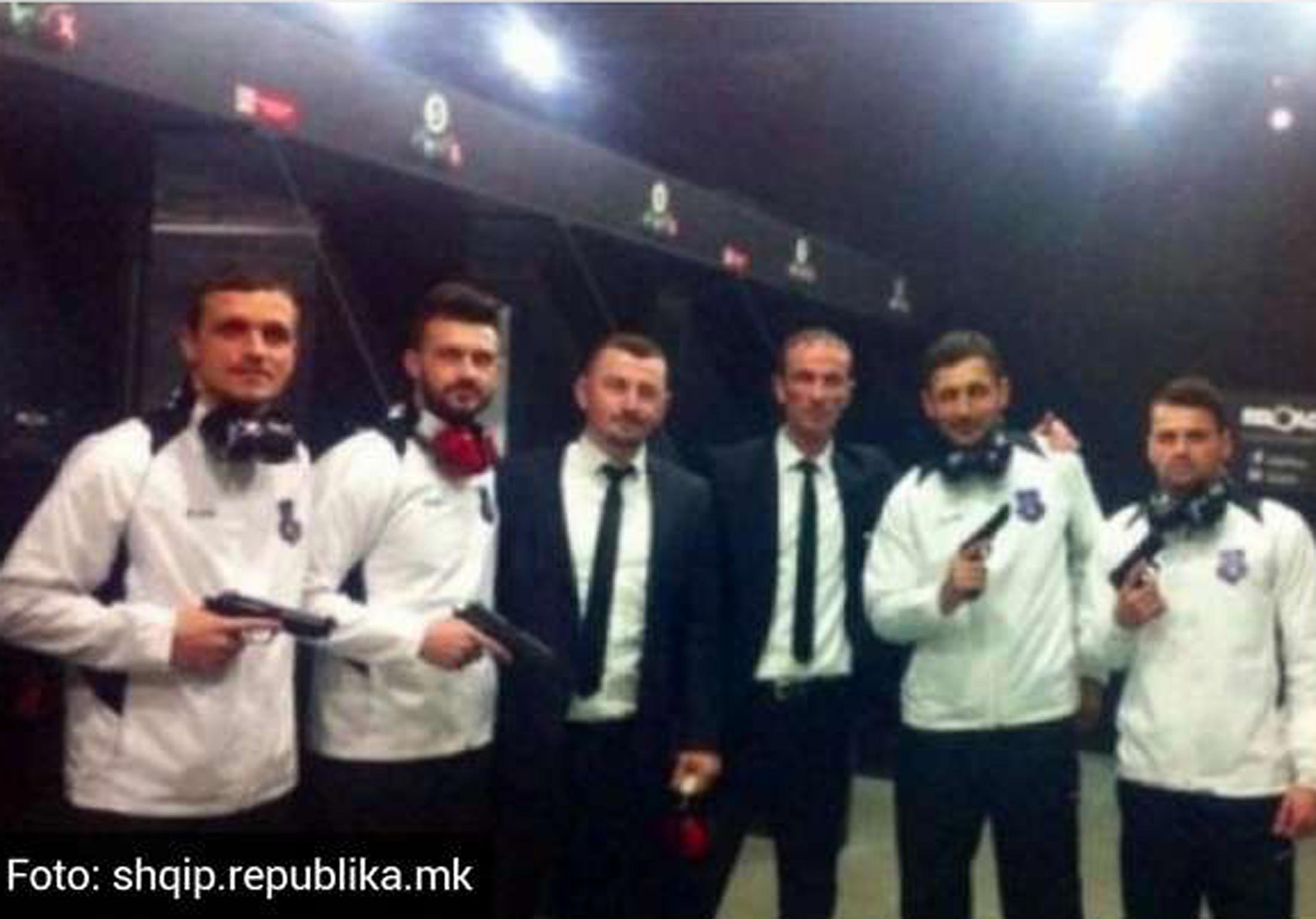 Members of the Kosovo national team pose with guns at a shooting range ahead of their first ever international, against Haiti