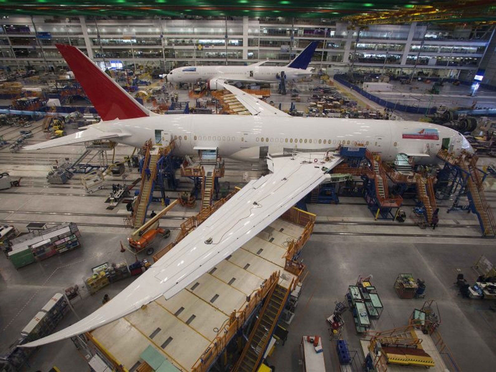 Workers at South Carolina Boeing work on a 787 Dreamliner for Air India at the plant's final assembly building in North Charleston, South Carolina in this December 19, 2013 file photo. Boeing Co said March 7, 2014 that "hairline cracks" had been discovere