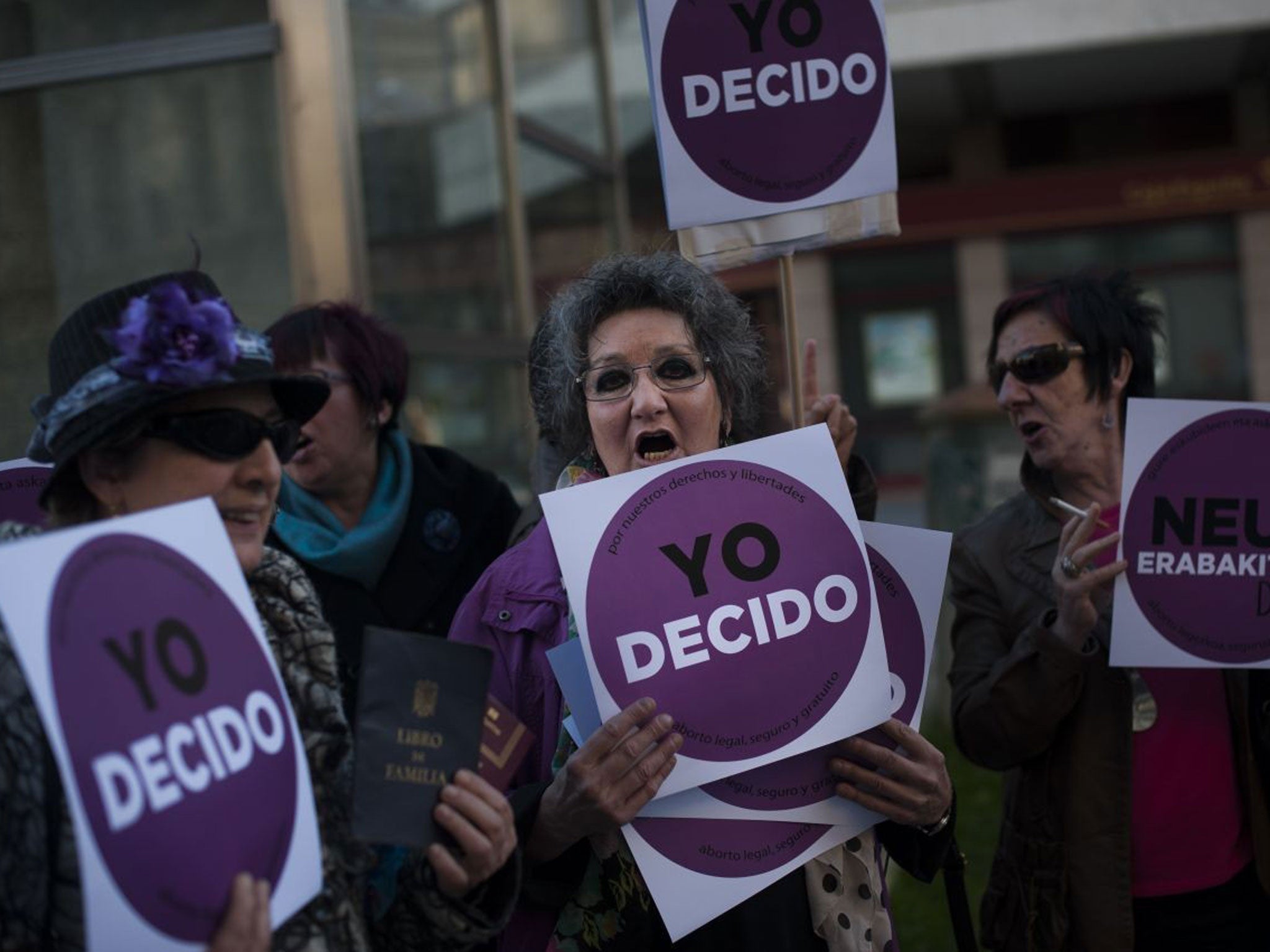 Women carry placards saying ‘I decide’ during the protests