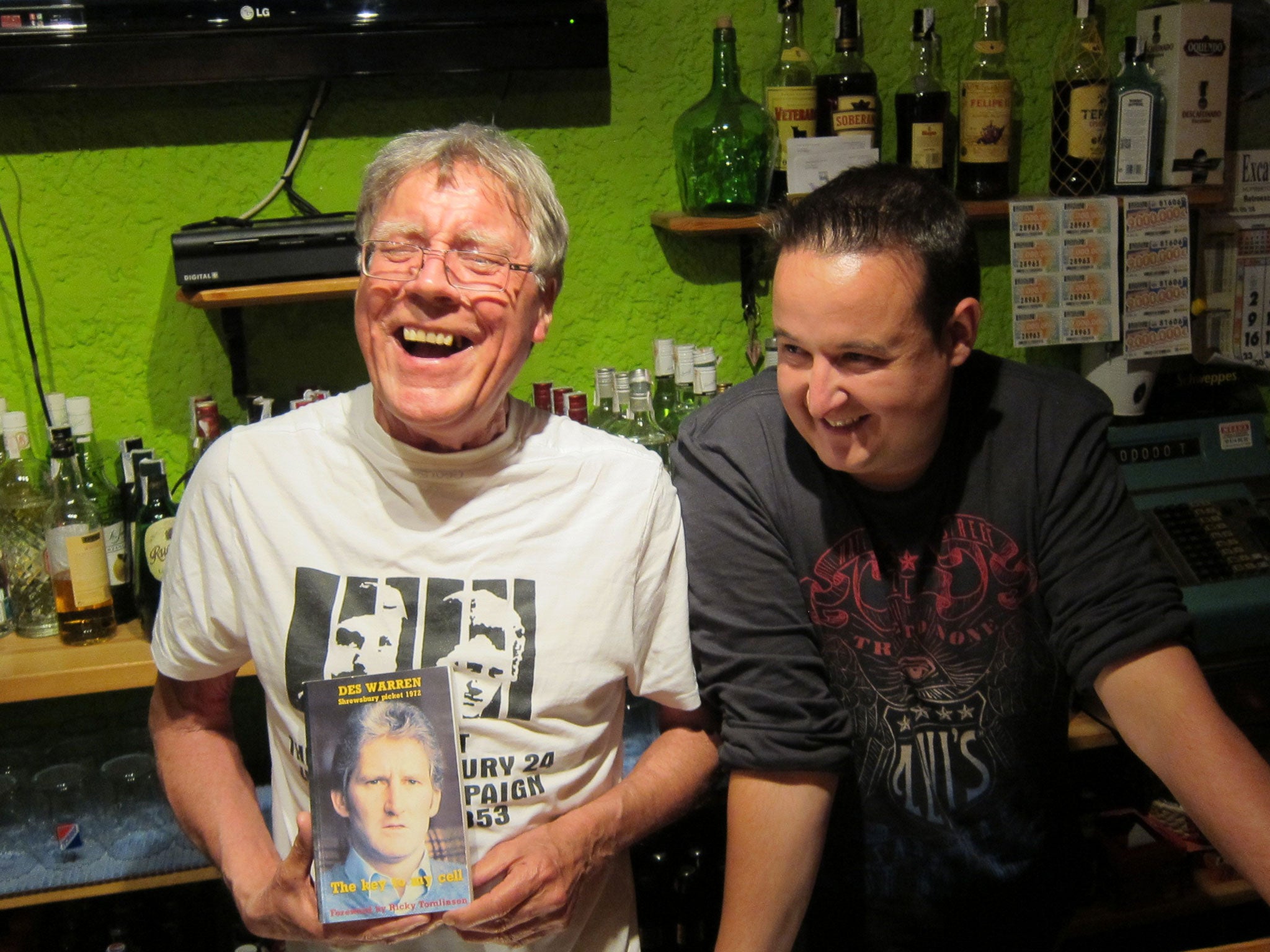 Abbott, left, in a Justice for the Shewsbury Pickets T-shirt and a copy of Des Warren's book 'The Key to my Cell'